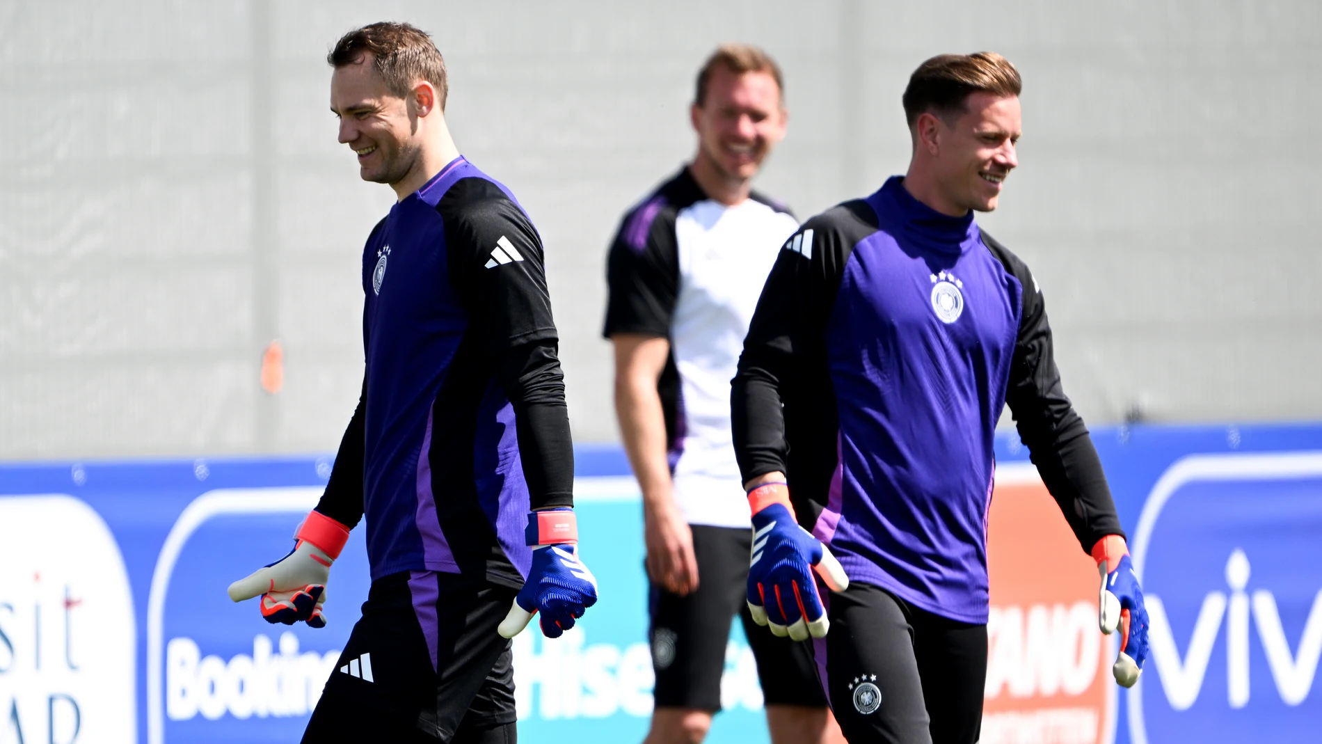 Germany's head coach Julian Nagelsmann, centre, watches as goalkeeper Manuel Neuer, left, and goalkeeper Marc-Andre ter Stegen attend a training session in Herzogenaurach, Germany, June 22, 2024. Germany will face Switzerland in their Group D soccer match at the Euro 2024 on June 23. (Federico Gambarini/dpa via AP)