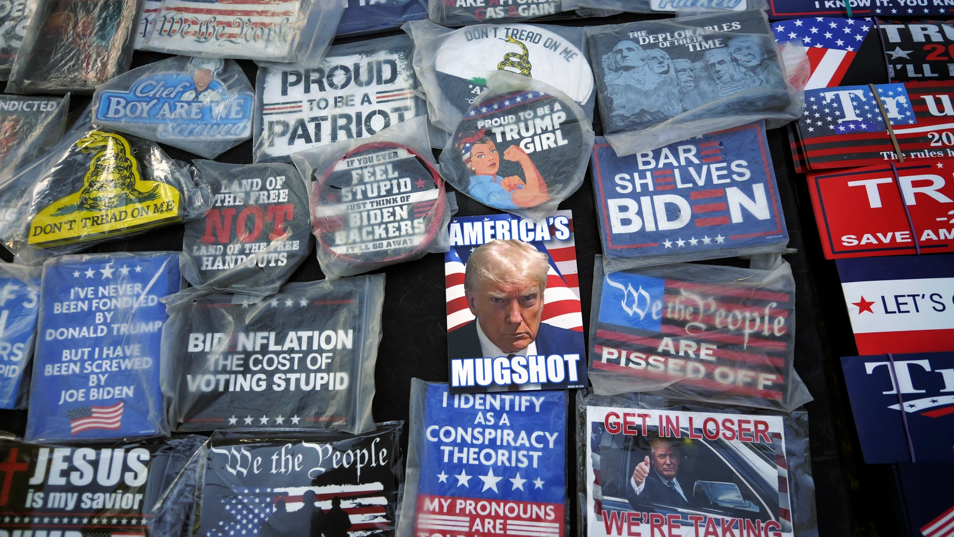 Campaign buttons are shown on a table during a rally for Trump-backed U.S. Senate candidate Trent Staggs and others on June 14, 2024, in Orem, Utah. Tuesday's primary election will determine if the state wants another moderate conservative like Romney or a farther-right candidate more willing to fall in line with former President Donald Trump. (AP Photo/Rick Bowmer)