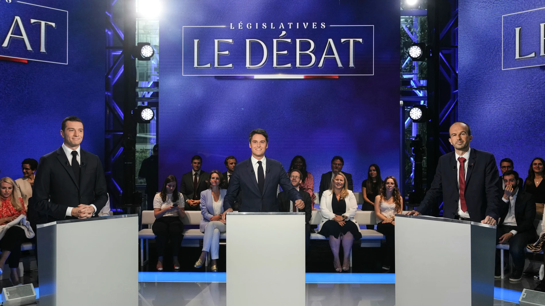 From the left, French far-right Rassemblement National (National Rally) party President Jordan Bardella, French Prime Minister Gabriel Attal and far-left party La France Insoumise (France Unbowed) member Manuel Bompard pose prior to a debate broadcasted on French TV channel TF1, in Boulogne-Billancourt, outside Paris, Tuesday, June 25, 2024. The two-round parliamentary election will take place on June 30 and July 7. (Dimitar Dilkoff, Pool via AP)