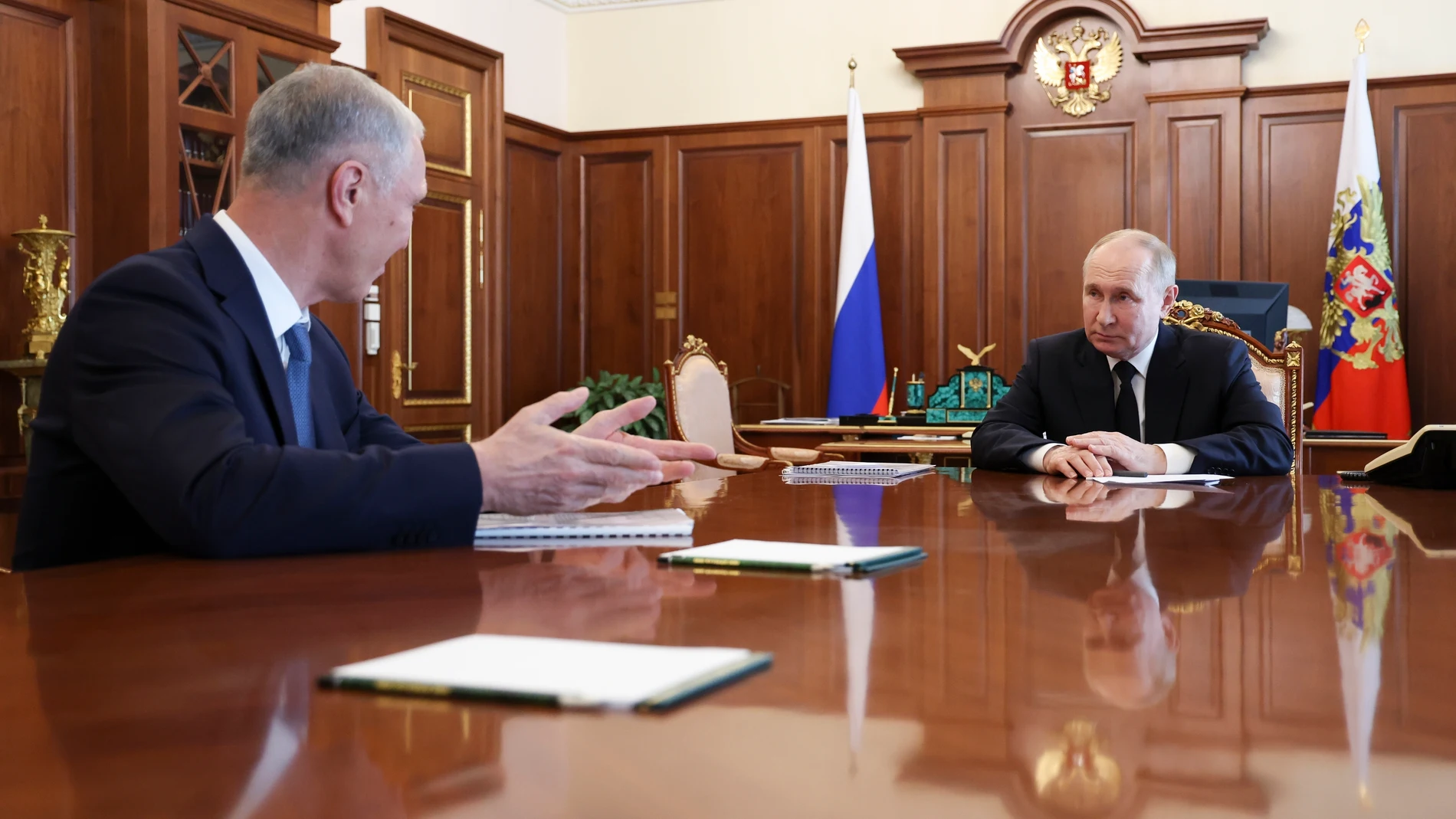 Russian President Vladimir Putin, right, listens to Vladimir Saldo, the Moscow-appointed head of the Russian-controlled Kherson region of Ukraine, during their meeting at the Kremlin in Moscow, Russia, Tuesday, June 25, 2024. (Vyacheslav Prokofyev, Sputnik, Kremlin Pool Photo via AP)