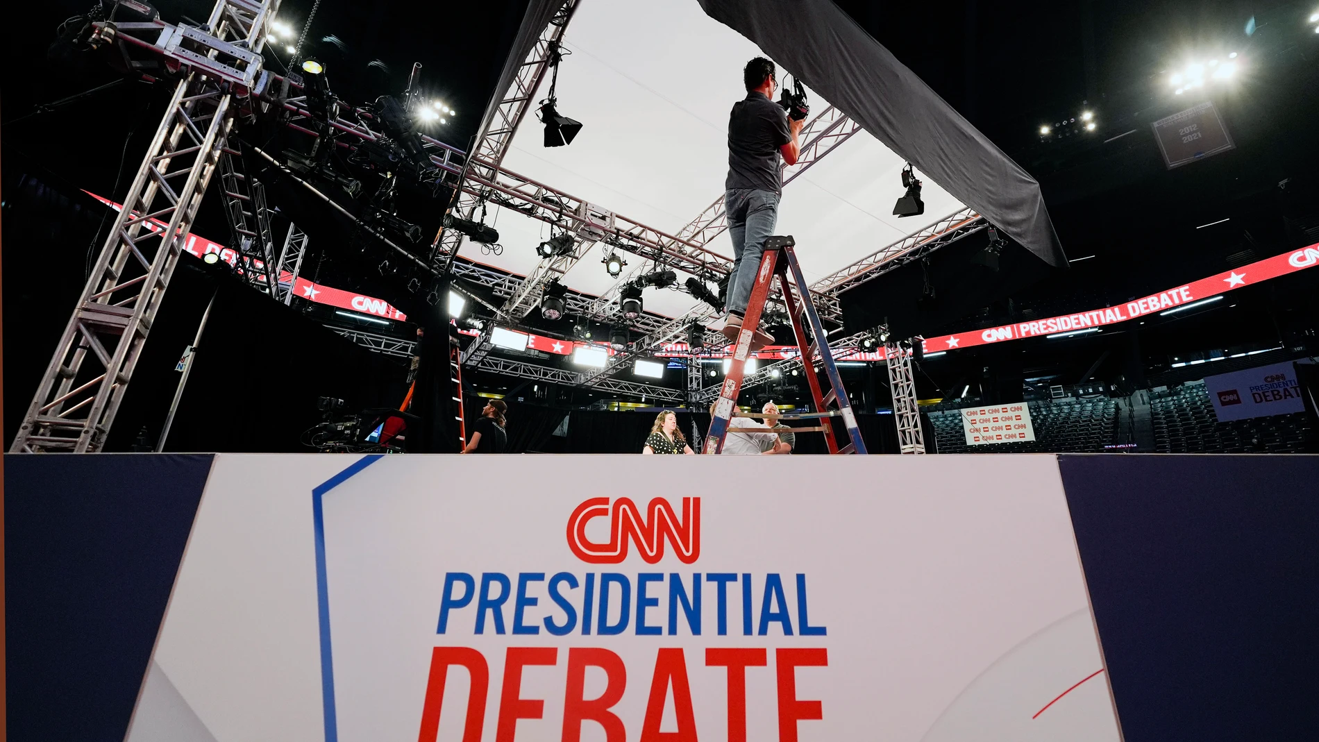 Ben Starett, lighting programmer for CNN, sets up lights in the spin room for the upcoming CNN Presidential Debate between President Joe Biden and Republican presidential candidate former President Donald Trump in Atlanta, Wednesday, June 26, 2024. (AP Photo/Gerald Herbert)