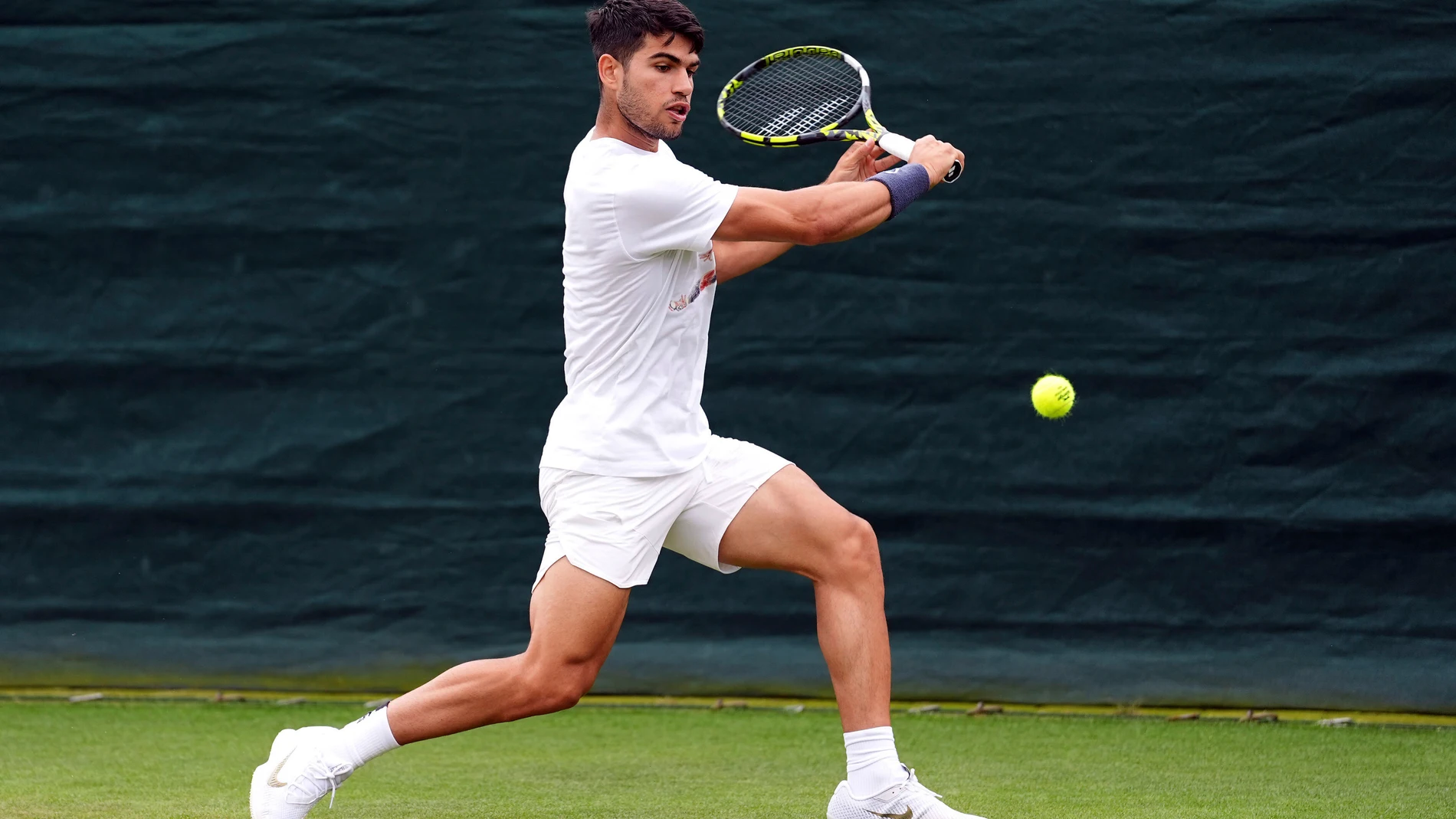 Spain's Carlos Alcaraz practises at the All England Lawn Tennis and Croquet Club in Wimbledon, ahead of the Wimbledon Championships, which begin on July 1st, in London, Thursday June 27, 2024. (Zac Goodwin/PA via AP)