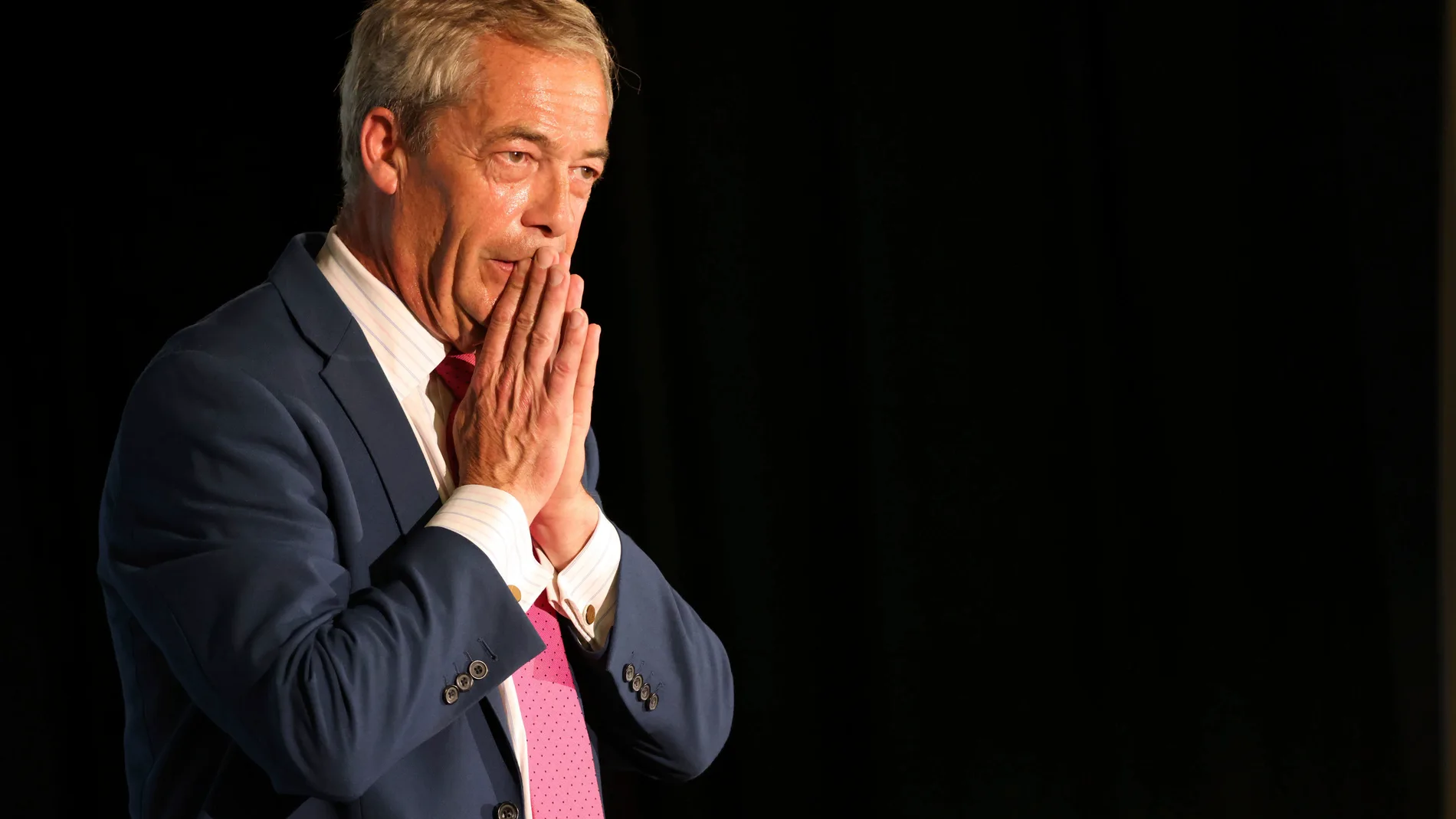 Reform UK Leader Nigel Farage gestures during a meeting while on the general election campaign trail, in Boston, England, Thursday June 27, 2024. (Paul Marriott/PA via AP)