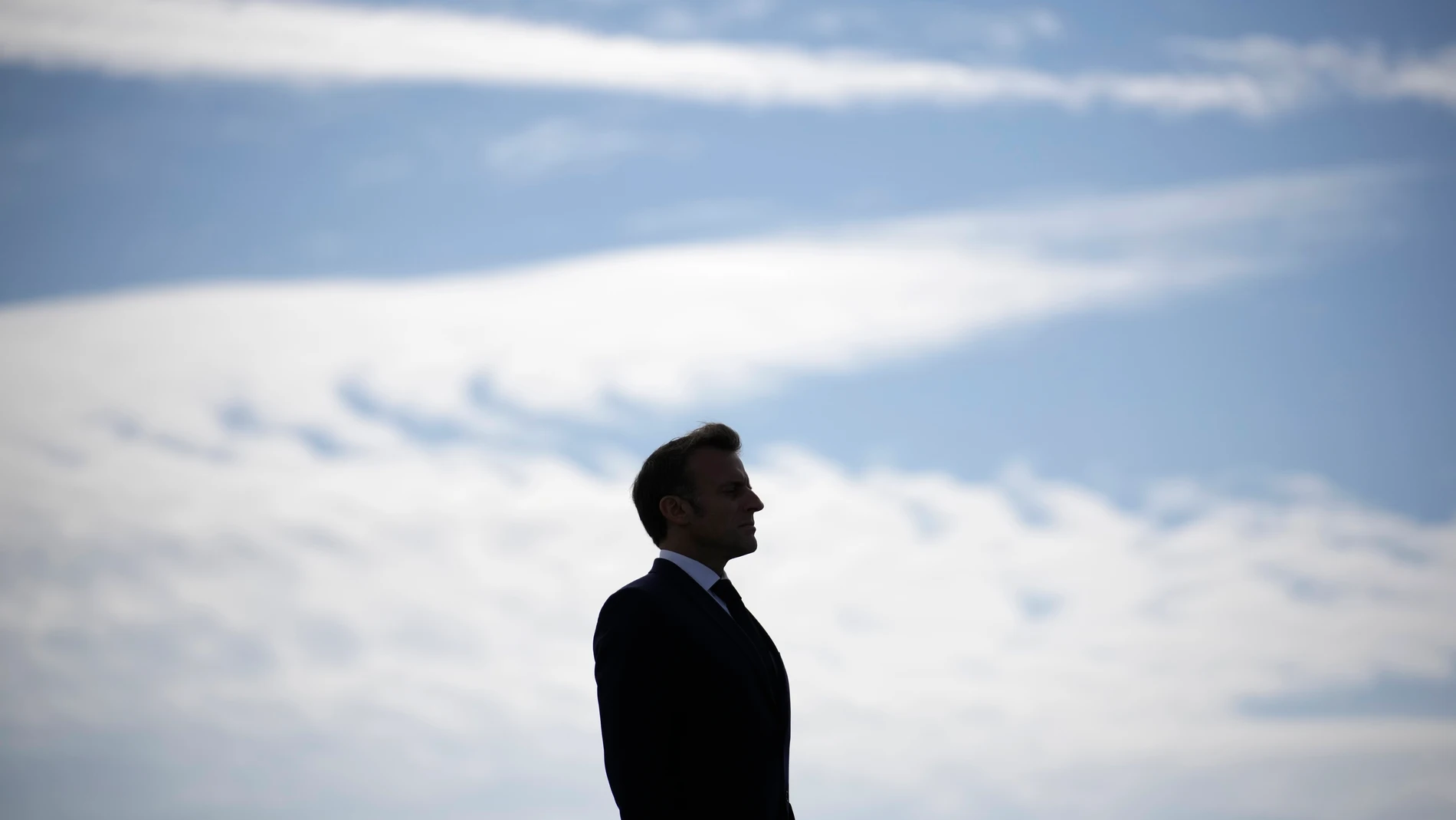 FILE - French President Emmanuel Macron attends a ceremony at the Croix du Souvenir monument, Tuesday, June 18, 2024 on the Île de Sein, Brittany. Emmanuel Macron once appeared as a bold, young leader offering to revive France through radical pro-business, pro-European policies so that voters have "no reason anymore" to vote for the extremes. Seven years after he was first elected, his call for snap elections weakens him at home and abroad, while it appears to propel the far right on the verg...