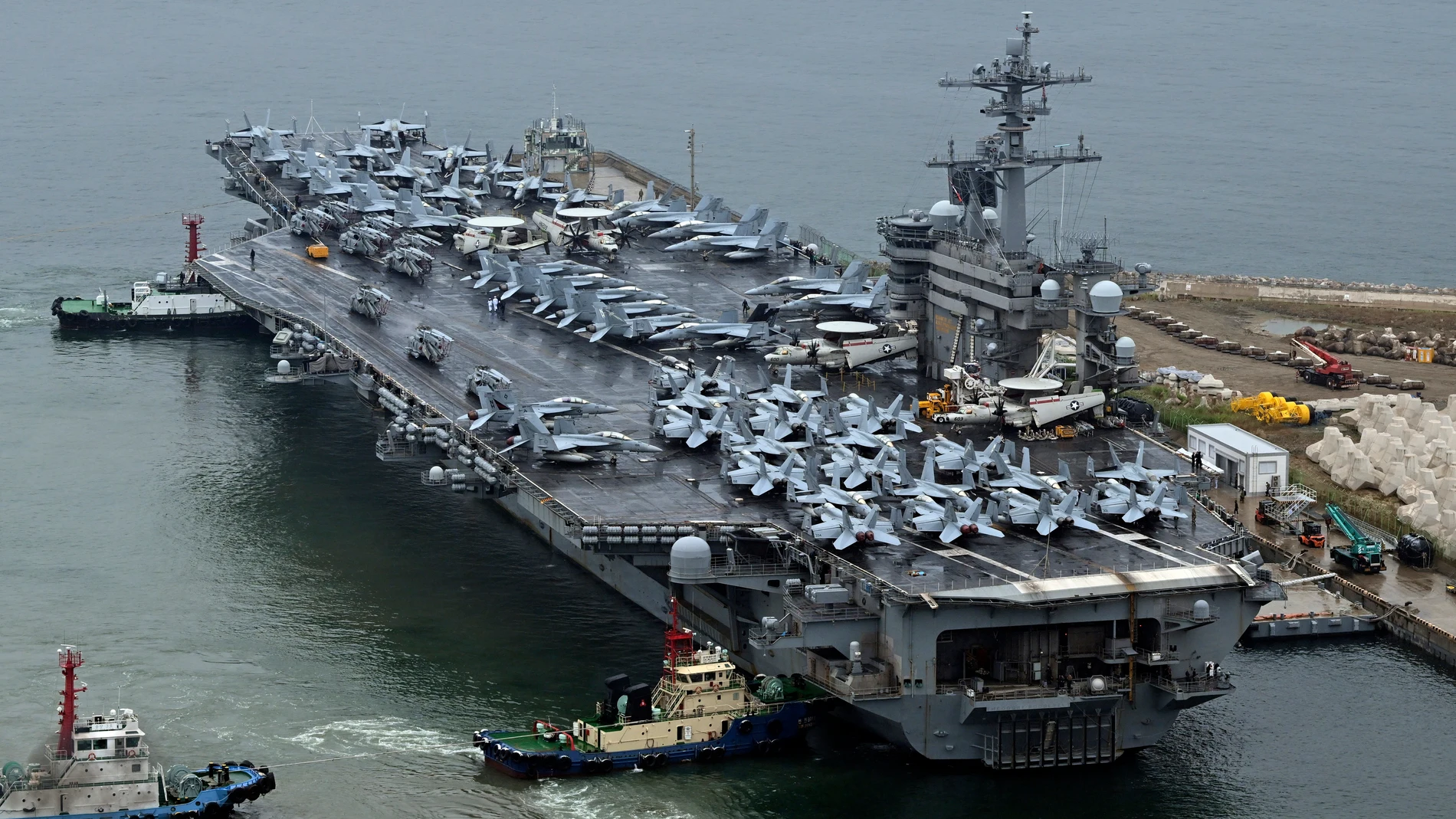 FILE - The Theodore Roosevelt (CVN 71), a nuclear-powered aircraft carrier is anchored in Busan, South Korea, on June 22, 2024. The newly-inaugurated Freedom Edge exercise is wrapping up in the East China Sea, having brought together Japanese, South Korean and American naval assets for multi-domain maneuvers for the first time.(Song Kyung-Seok/Pool Photo via AP, File)