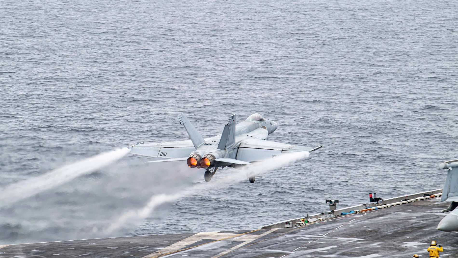 In this photo provided by the U.S. Navy, a U.S. fighter jet takes off from USS Theodore Roosevelt aircraft carrier during the Freedom Edge exercise by the U.S., Japanese and South Korea at East Sea on Friday, June 28, 2024. (Mass Communication Specialist 2nd Class Rashan Jefferson/The U.S. Navy via AP)