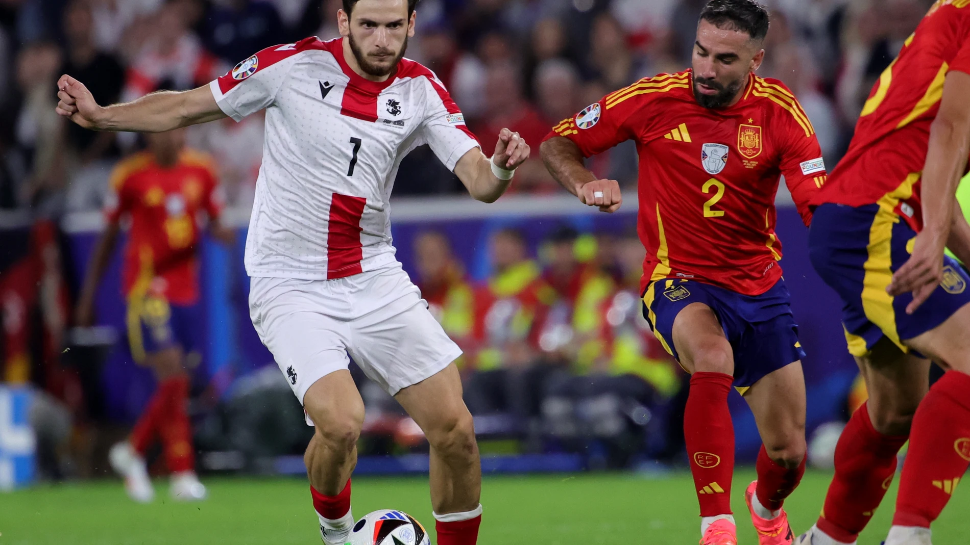 Cologne (Germany), 30/06/2024.- Khvicha Kvaratskhelia of Georgia (L) and Dani Carvajal of Spain in action during the UEFA EURO 2024 Round of 16 soccer match between Spain and Georgia, in Cologne, Germany, 30 June 2024. (Alemania, España, Colonia) EFE/EPA/OLIVIER MATTHYS