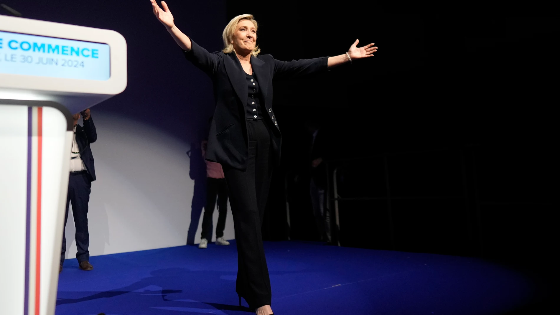 French far right leader Marine Le Pen gestures after delivering her speech after the release of projections based on the actual vote count in select constituencies , Sunday, June 30, 2024 in Henin-Beaumont, northern France. French voters propelled the far-right National Rally to a strong lead in first-round legislative elections Sunday and plunged the country into political uncertainty, according to polling projections. (AP Photo/Thibault Camus)