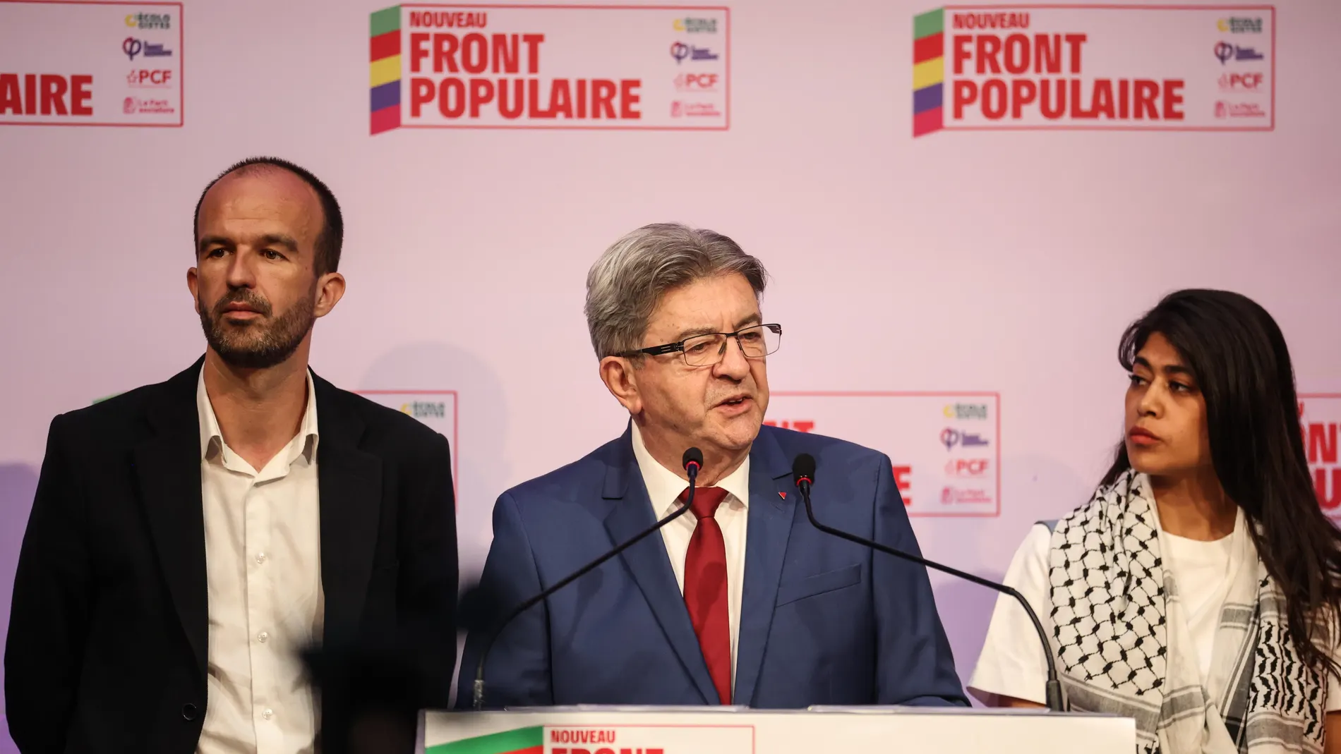 Paris (France), 30/06/2024.- French left-wing La France Insoumise (LFI) party leader Jean-Luc Melenchon (C) reacts to initial results of the first round of legislative elections, next to French member of Parliament for La France Insoumise (LFI) party Manuel Bompard (L) and French-Palestinian activist and European deputy of La France Insoumise (LFI) party Rima Hassan (R), in Paris, France, 30 June 2024. President Macron called for snap elections after the defeat of his Renaissance Party agains...