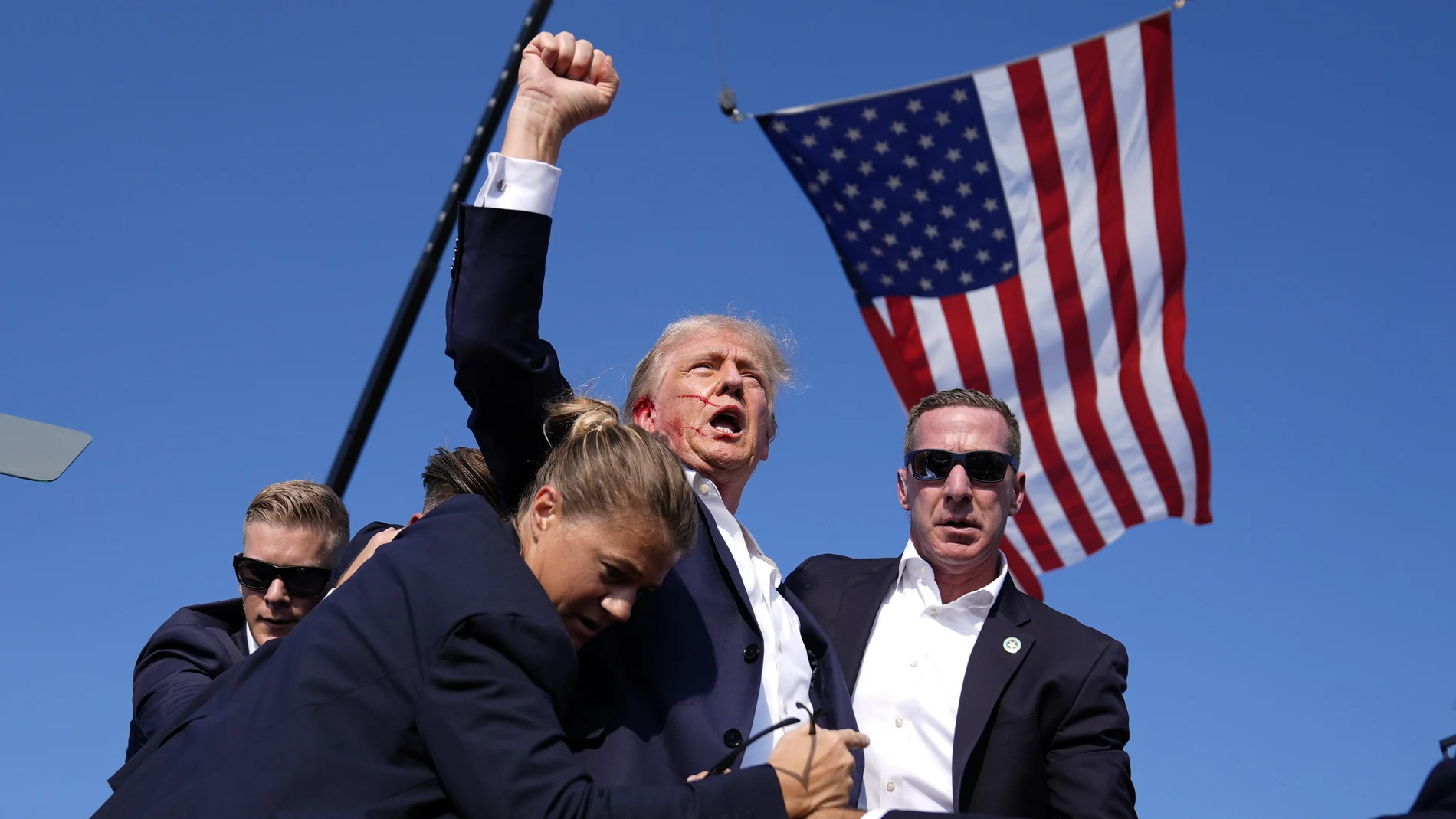 Republican presidential candidate former President Donald Trump is surrounded by U.S. Secret Service agents at a campaign rally, Saturday, July 13, 2024, in Butler, Pa. (AP Photo/Evan Vucci)