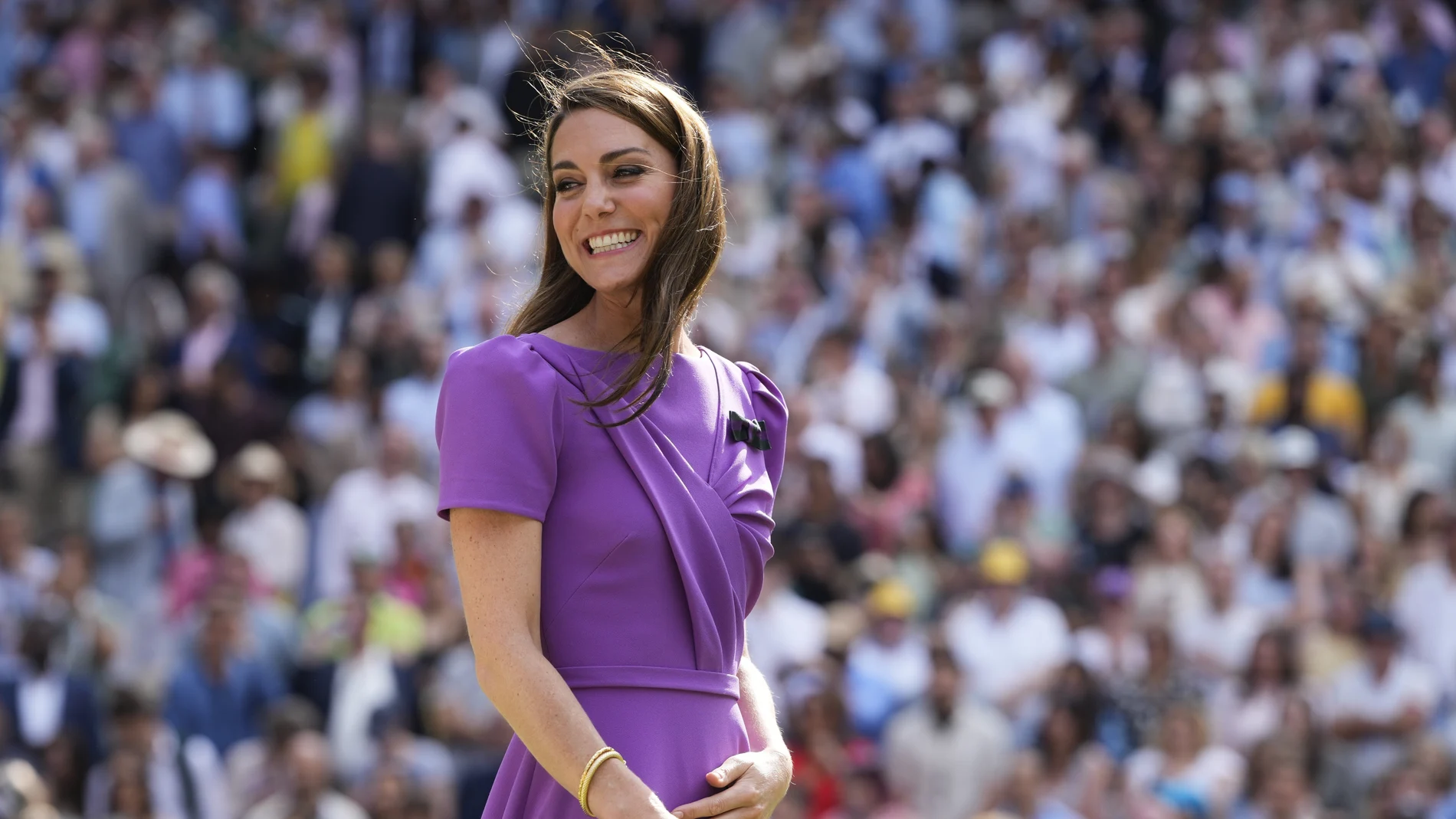 Kate, Princess of Wales, smiles as she waits to present the trophy to Carlos Alcaraz of Spain at the men's singles final at the Wimbledon tennis championships in London, July 14, 2024. (AP Photo/Kirsty Wigglesworth)