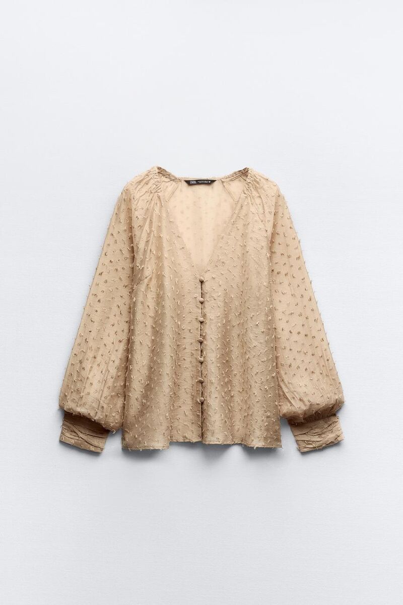 Blusa semitransparente plumeti