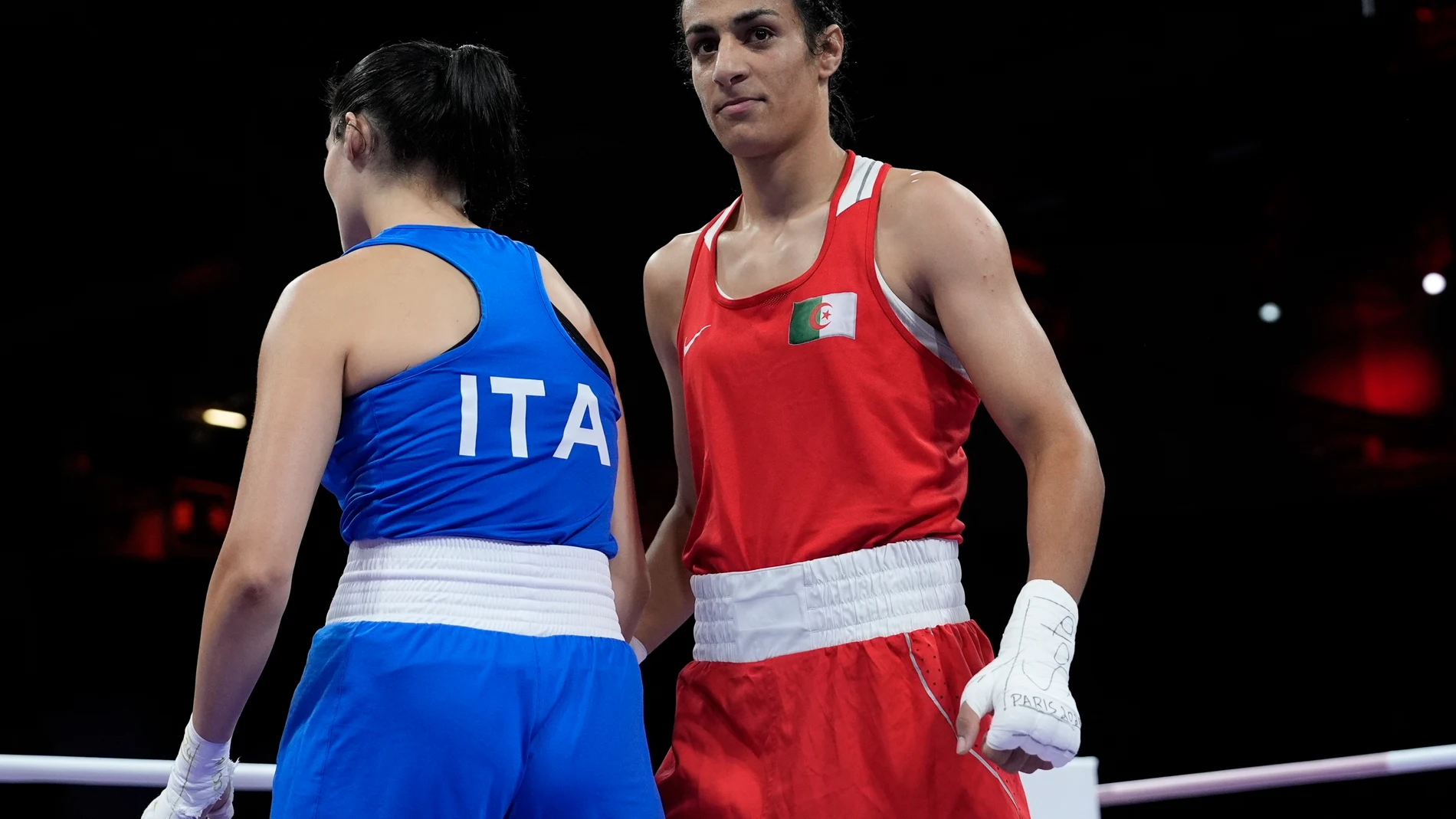 Algeria's Imane Khelif, right, after defeating Italy's Angela Carini, left, in their women's 66kg preliminary boxing match at the 2024 Summer Olympics, Thursday, Aug. 1, 2024, in Paris, France. (AP Photo/John Locher)