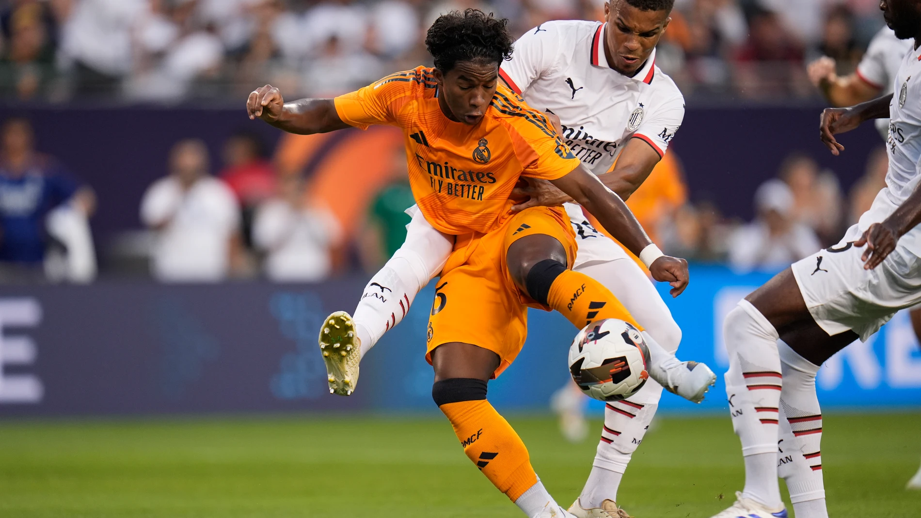 Real Madrid forward Endryck Moreira, left, and Milan defender Malick Thiaw fight for control of the ball during the first half of a friendly soccer match Wednesday, July 31, 2024, in Chicago. (AP Photo/Erin Hooley)