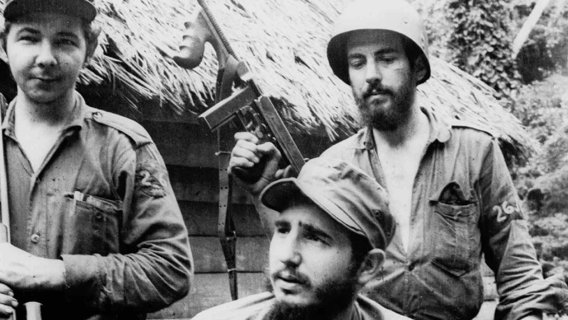 Fidel Castro, the young anti-Batista guerrilla leader, center, is seen with his brother Raul Castro, left, and Camilo Cienfuegos, right, while operating in the Mountains of Eastern Cuba.