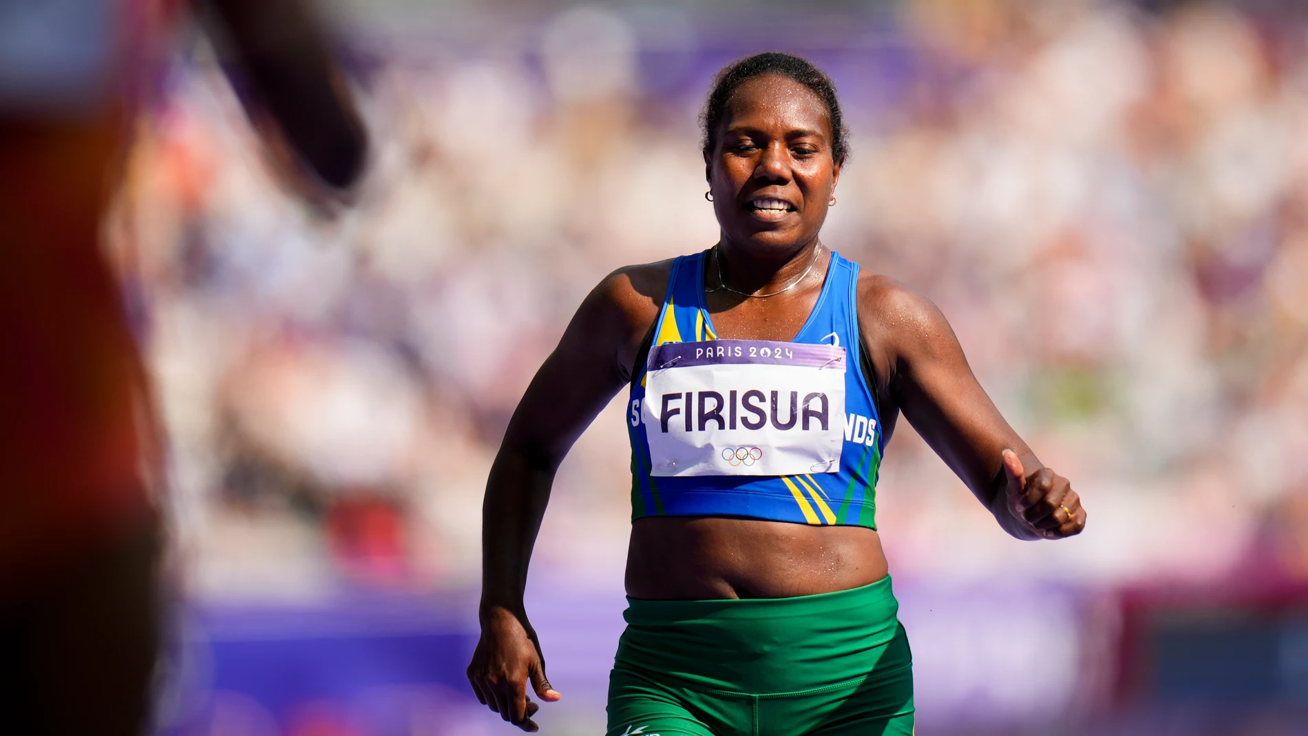 Sharon Firisua, of Solomon Islands, competes in the women's 100-meter run at the 2024 Summer Olympics, Friday, Aug. 2, 2024, in Saint-Denis, France. (AP Photo/Petr David Josek)