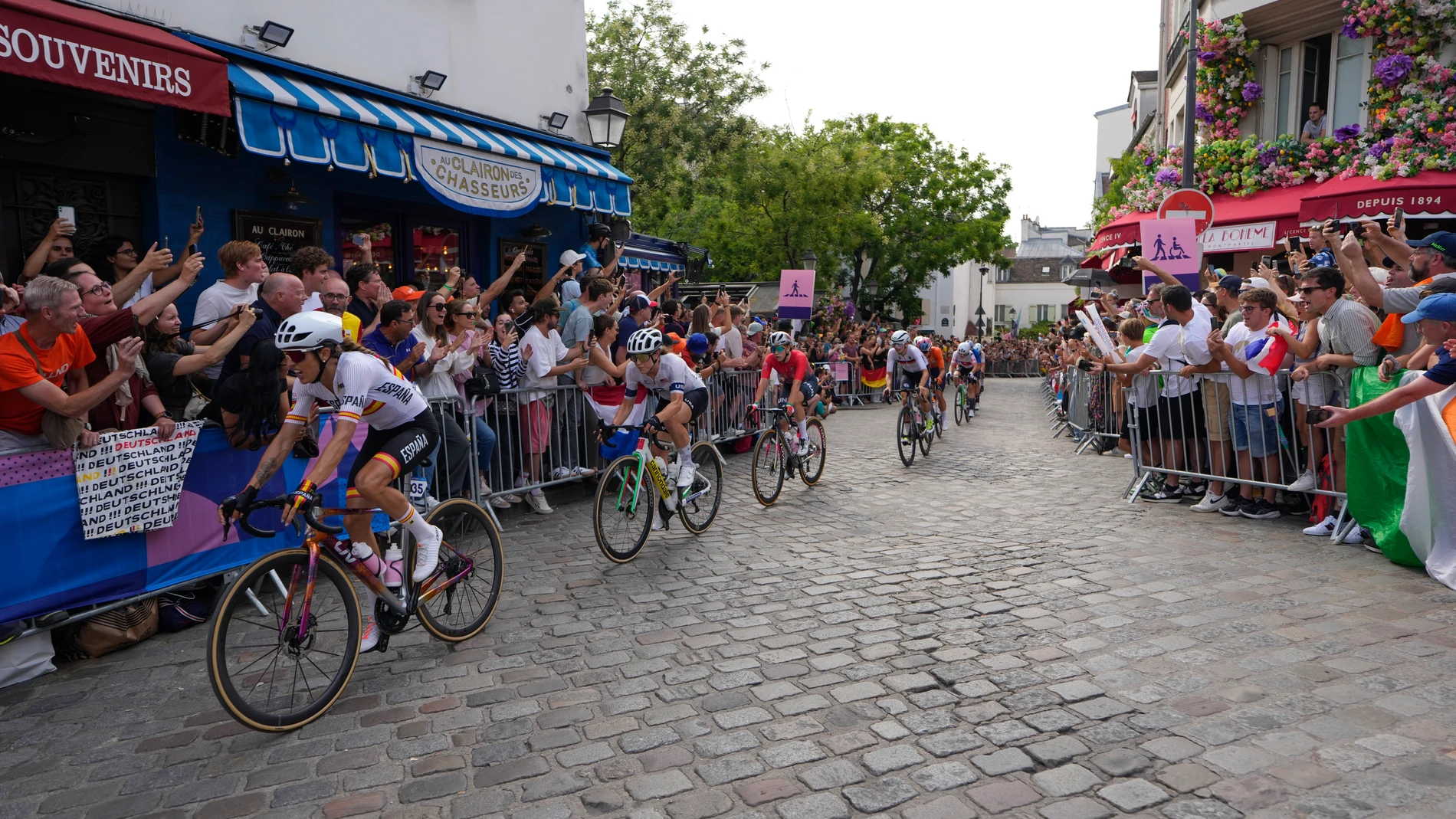Margarita Victoria Garcia, of Spain, left, rides along other competitors, during the women's road cycling event, at the 2024 Summer Olympics, Sunday, Aug. 4, 2024, in Paris, France. (AP Photo/Vadim Ghirda)