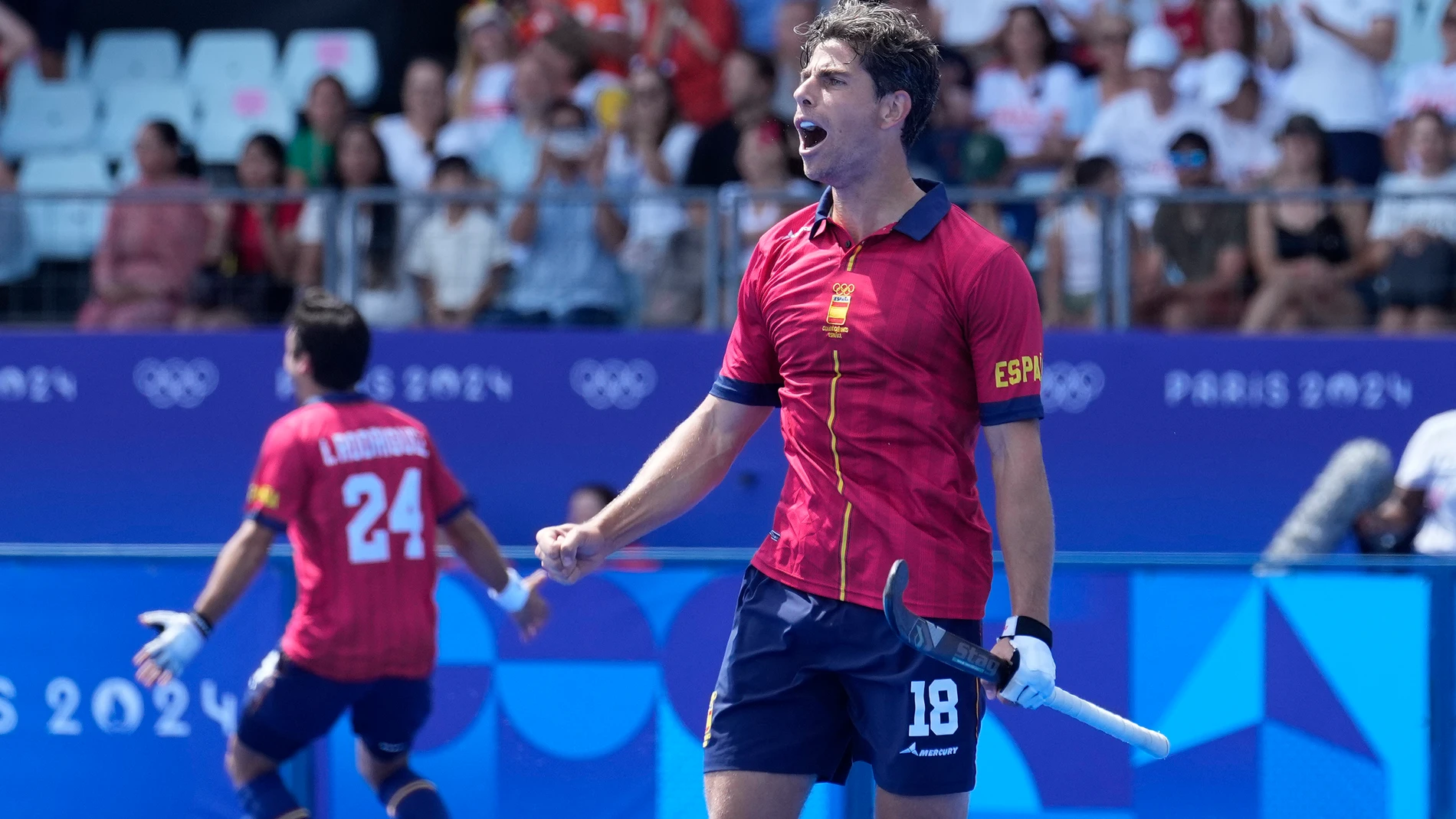 Spain's Joaquin Menini jubilates after winning the men's quarterfinal field hockey match against Belgium at the Yves-du-Manoir Stadium during the 2024 Summer Olympics, Sunday, Aug. 4, 2024, in Colombes, France. (AP Photo/Anjum Naveed)