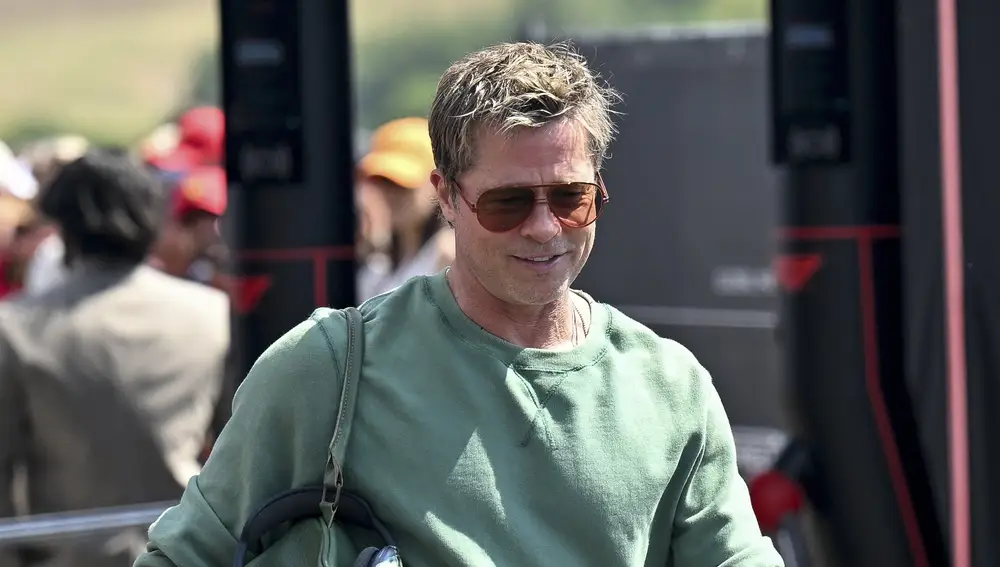 US actor Brad Pitt walks in the paddock prior to the practice sessions for the Formula One Hungarian Grand Prix at the Hungaroring circuit