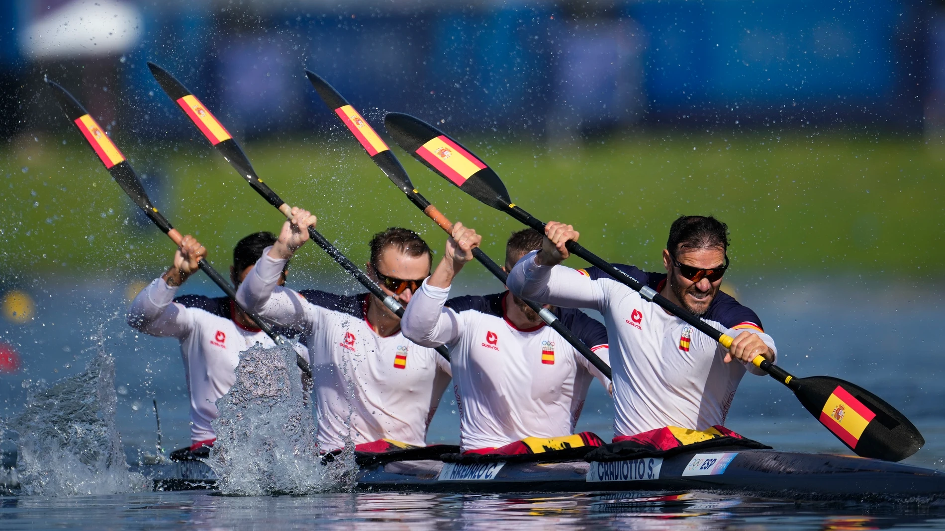 Spain's Carlos Arevalo, Marcus Cooper, Saul Craviotto and Rodrigo Germade compete in the men's kayak four 500-meter heats at the 2024 Summer Olympics, Tuesday, Aug. 6, 2024, in Vaires-sur-Marne, France. (AP Photo/Ebrahim Noroozi)