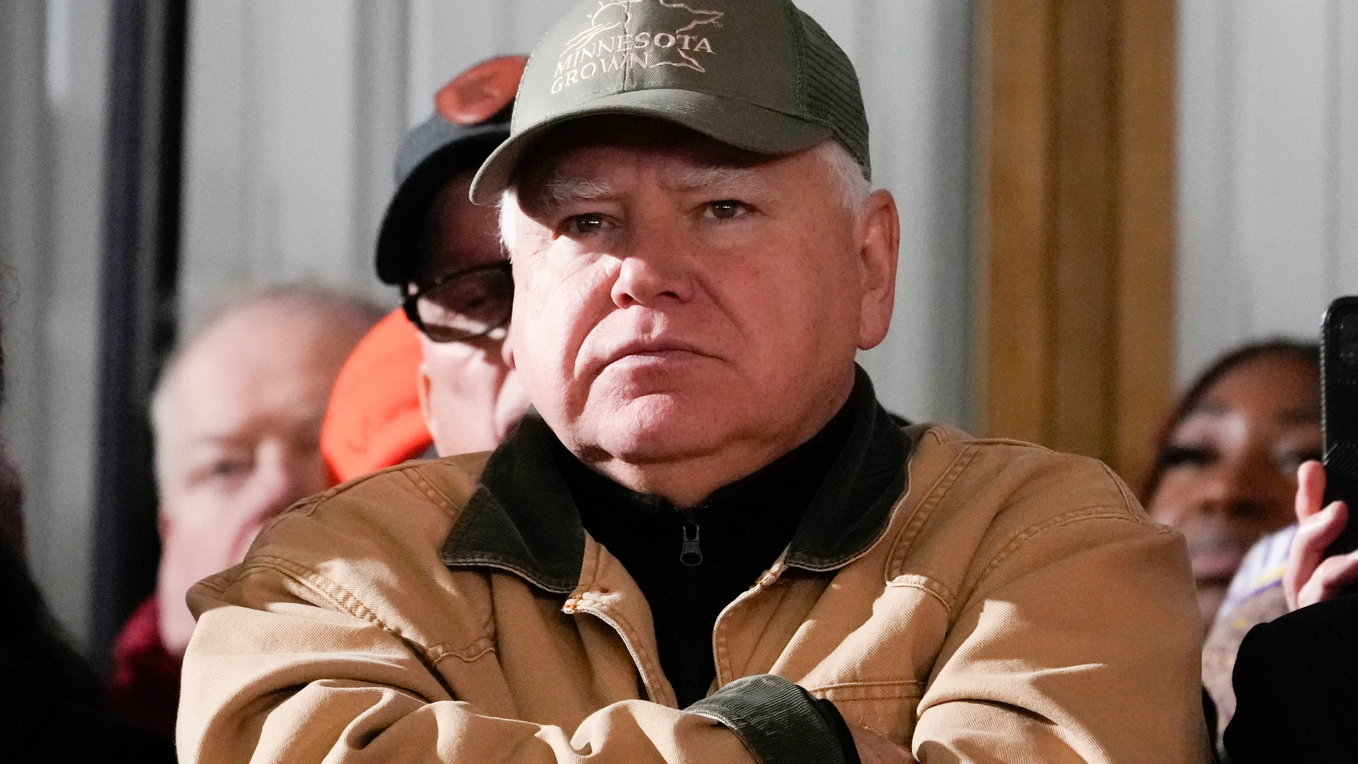 FILE - Minnesota Gov. Tim Walz listens as President Joe Biden speaks at Dutch Creek Farms in Northfield, Minn., Nov. 1, 2023. (AP Photo/Andrew Harnik, File)