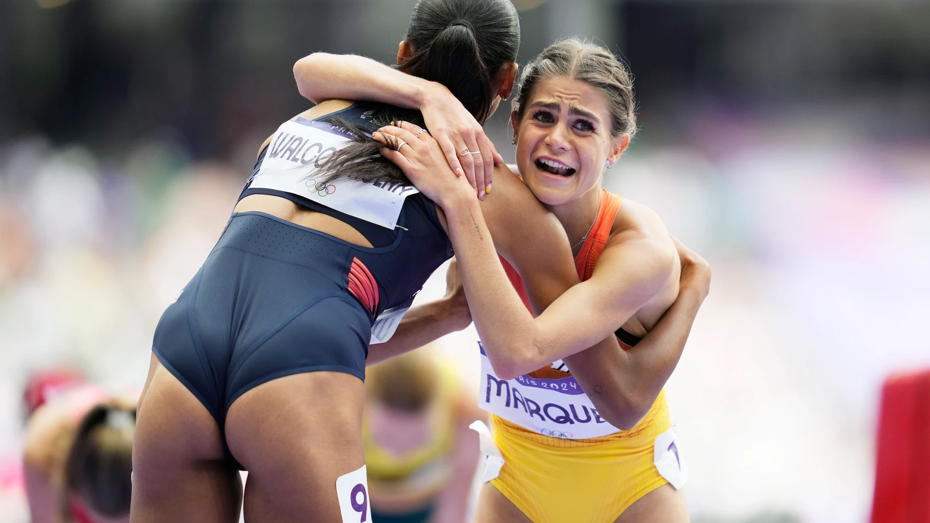 Revee Walcott-Nolan, left, of Britain, and Agueda Marques, of Spain, embrace following their women's 1500-meter repechage at the 2024 Summer Olympics, Wednesday, Aug. 7, 2024, in Saint-Denis, France. (AP Photo/Ashley Landis)