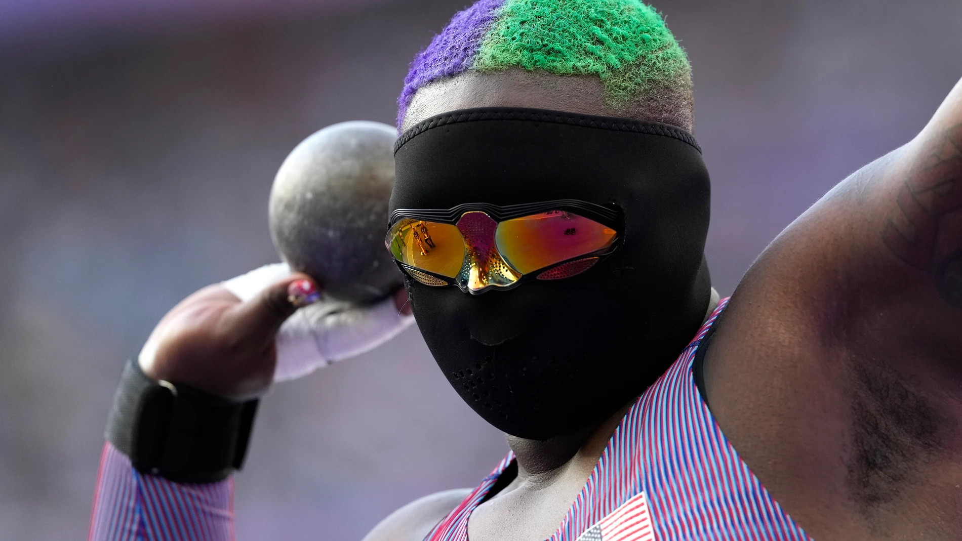Raven Saunders, of the United States, competes during the women's shot put qualification at the 2024 Summer Olympics, Thursday, Aug. 8, 2024, in Saint-Denis, France. (AP Photo/Bernat Armangue)