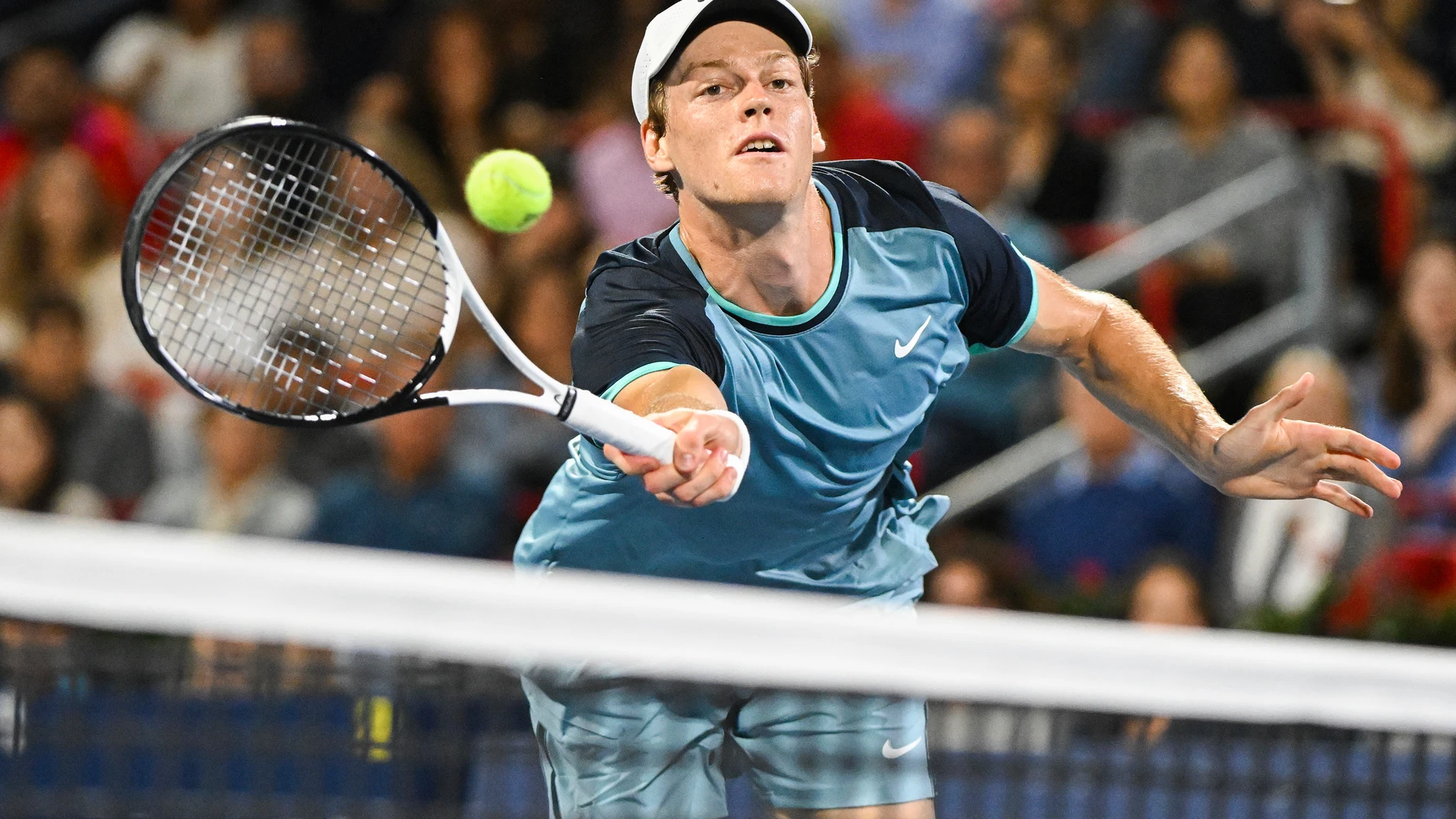 Jannik Sinner, of Italy, plays a shot to Andrey Rublev, of Russia, during their quarterfinal match at the National Bank Open tennis tournament in Montreal, Saturday, Aug. 10, 2024. (Graham Hughes/The Canadian Press via AP)