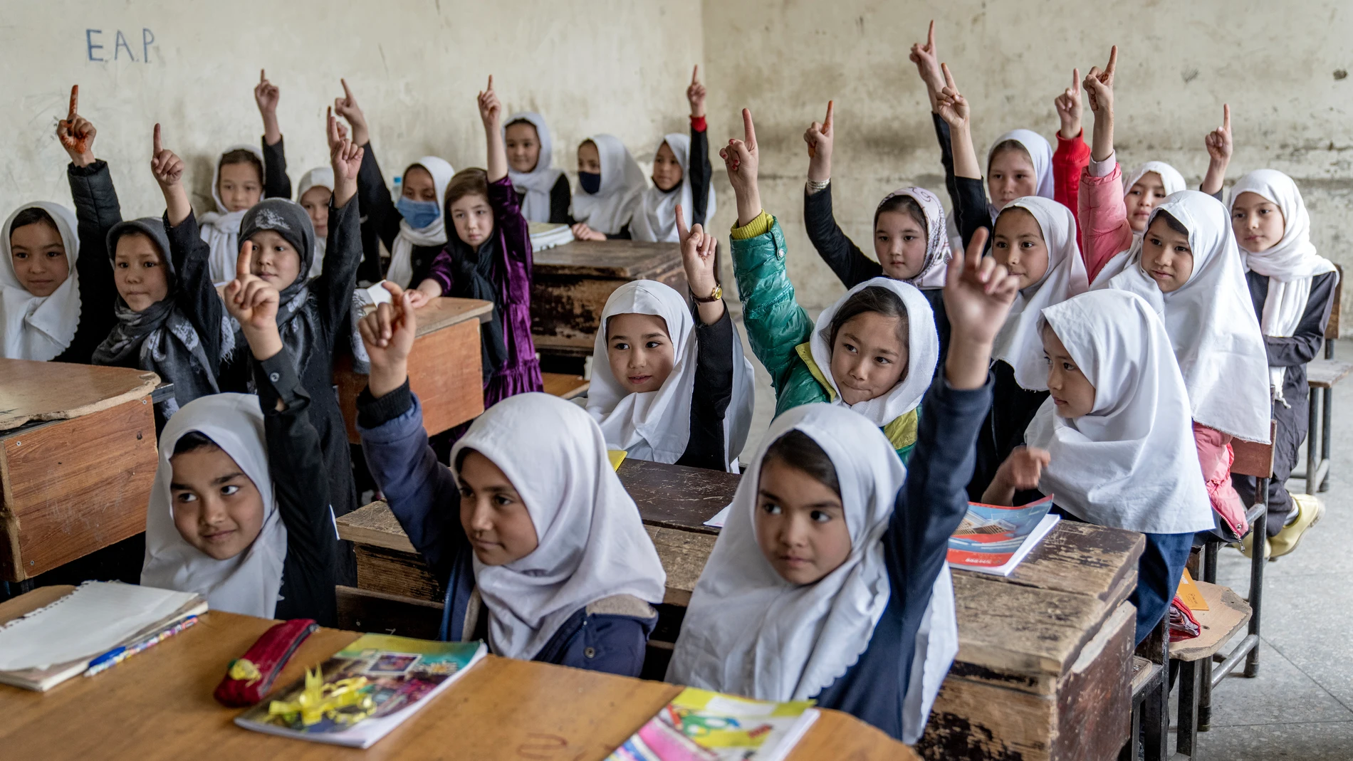 FILE - Afghan school girls attend their classroom on the first day of the new school year, in Kabul, Saturday, March 25, 2023. (AP Photo/Ebrahim Noroozi, File)