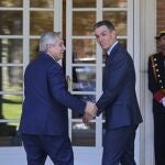Argentina's President Alberto Fernandez, left and Spain's Prime Minister Pedro Sanchez walk into the Moncloa Palace for a meeting in Madrid, Spain, Tuesday, May 10, 2022.