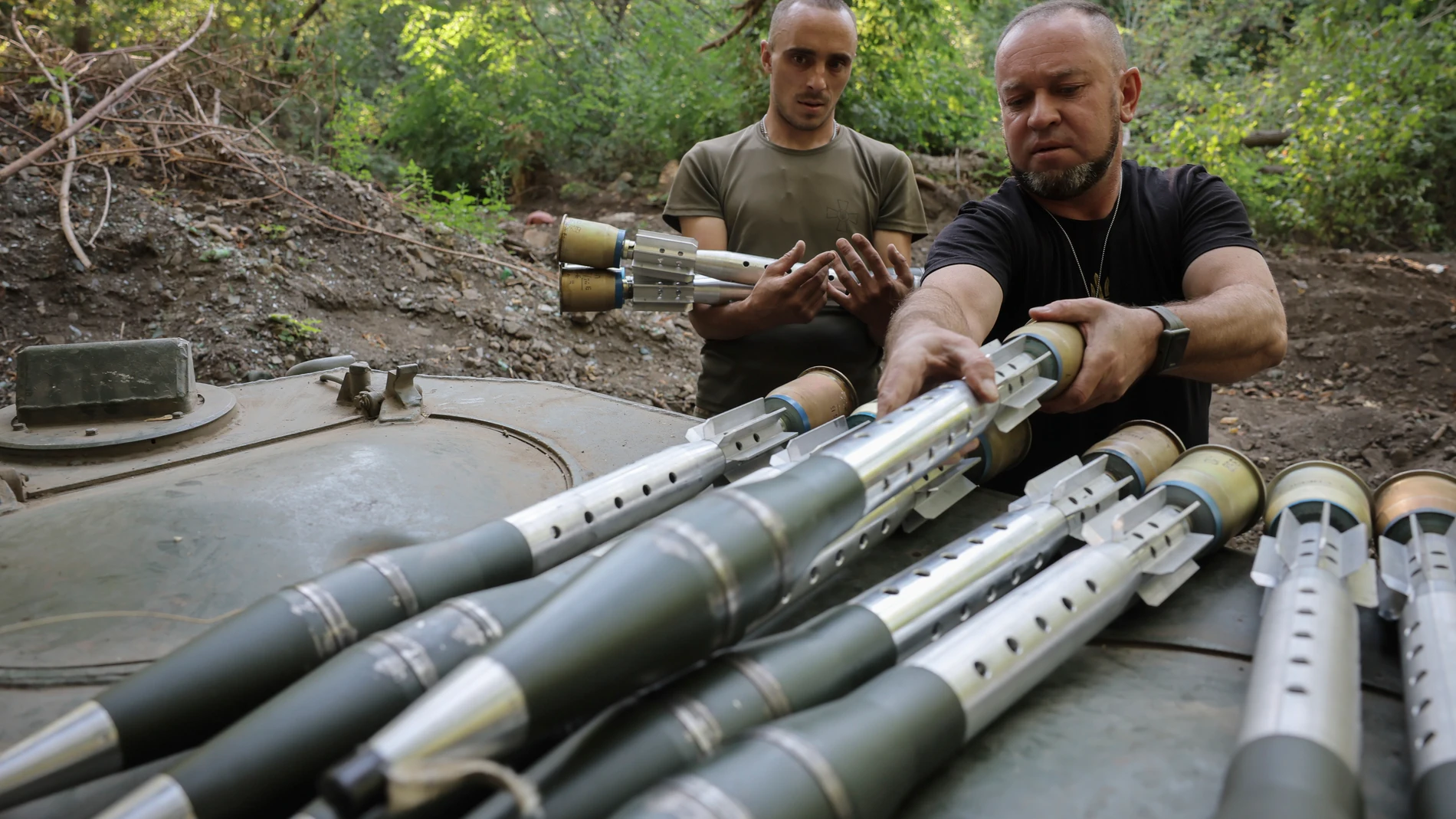In this photo provided by Ukraine's 24th Mechanised Brigade press service, servicemen of 24th mechanised brigade prepare to fire BRM1k infantry fighting vehicle towards Russian positions near Chasiv Yar town, in Donetsk region, Ukraine, Saturday Aug. 17, 2024. (Oleg Petrasiuk/Ukrainian 24th Mechanised Brigade via AP)