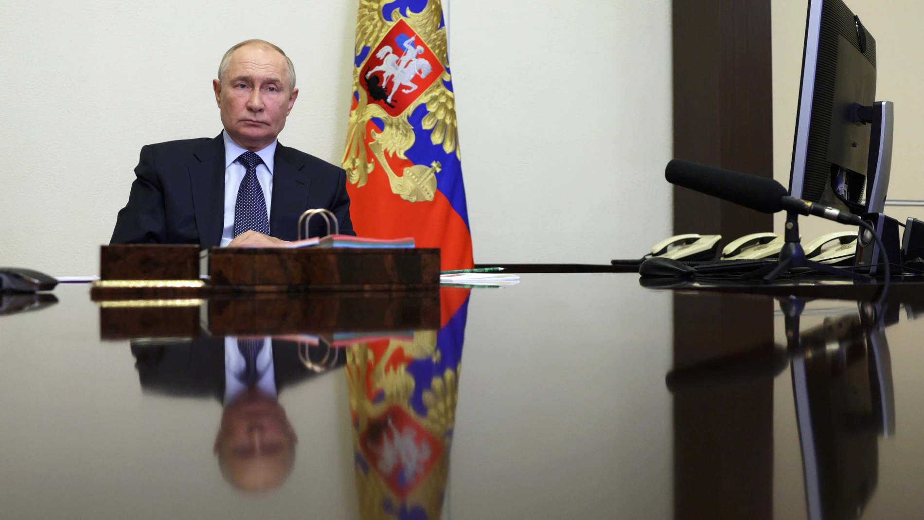 Russian President Vladimir Putin chairs a meeting with members of the government via videoconference at the Novo-Ogaryovo state residence, outside Moscow, Russia, Thursday, Aug. 22, 2024. (Gavriil Grigorov, Sputnik, Kremlin Pool Photo via AP)