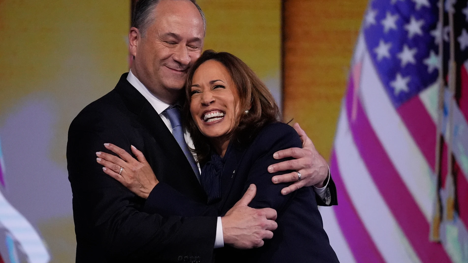 Democratic presidential nominee Vice President Kamala Harris hugs Second gentleman Douglas Emhoff after the nomination during the Democratic National Convention Thursday, Aug. 22, 2024, in Chicago. (AP Photo/Brynn Anderson)