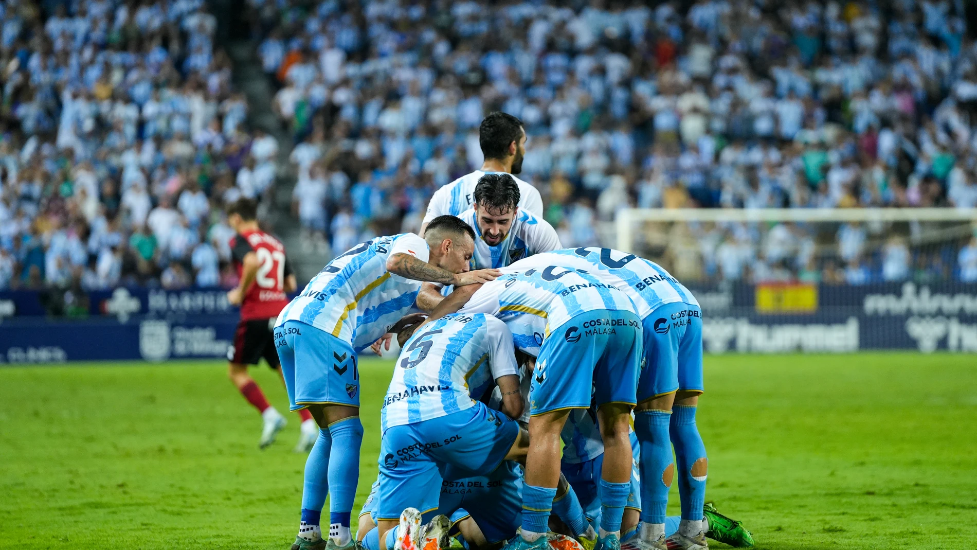 Dioni Villalba of Malaga CF celebrates a goal with teammates during the Spanish league, LaLiga Hypermotion, football match played between Malaga CF and CD Mirandes at La Rosaleda stadium on August 24, 2024, in Malaga, Spain. AFP7 24/08/2024 ONLY FOR USE IN SPAIN