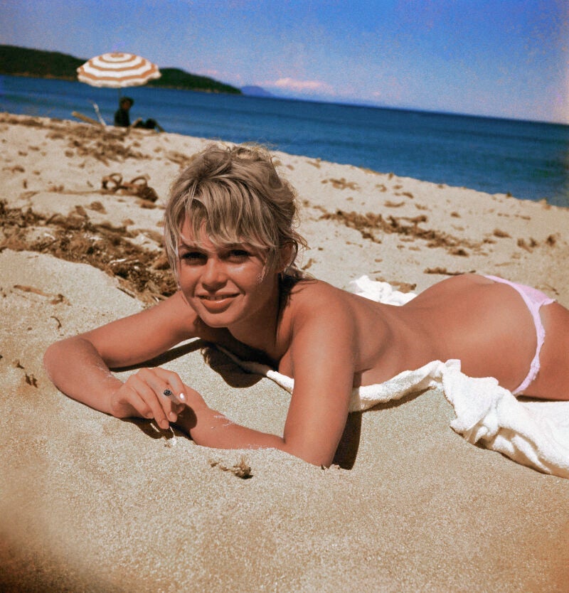 Brigitte Bardot, originally Camille Javal, actress, pictured here on a towel, sunning on the beach in 1960.