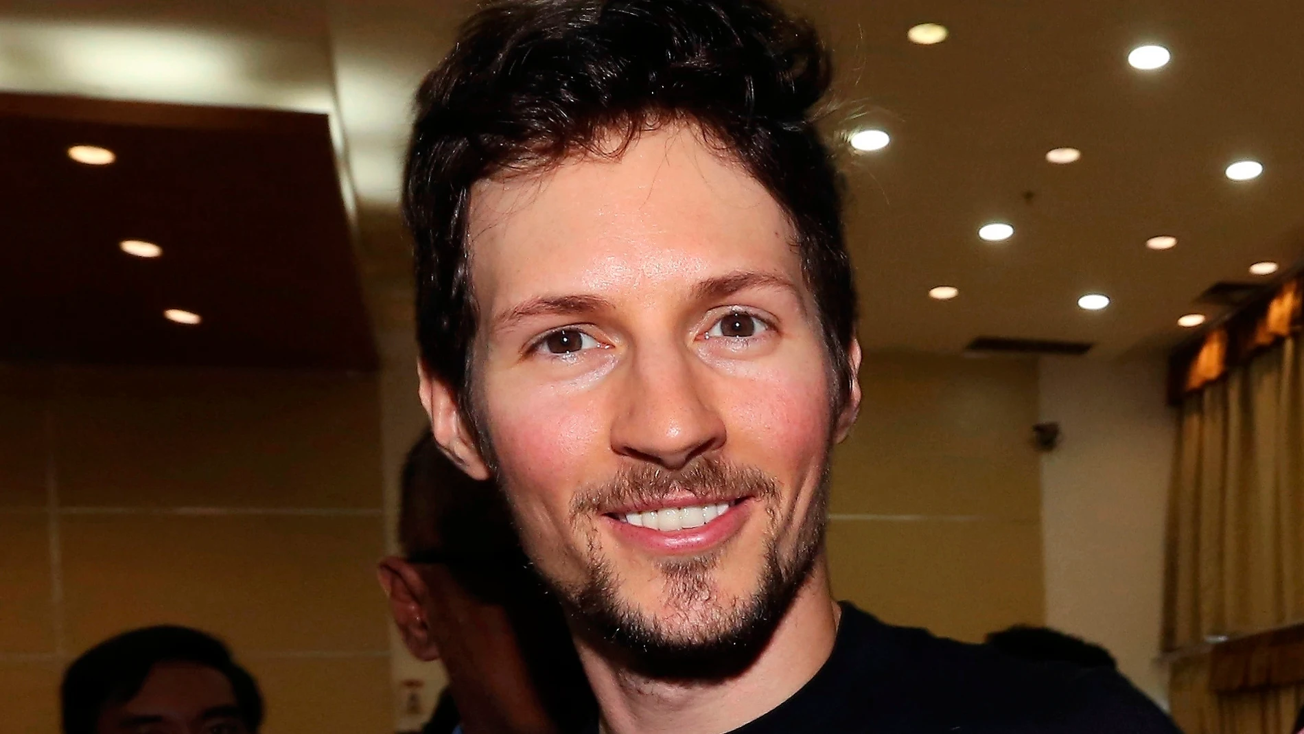 FILE - Telegram co-founder Pavel Durov, center, smiles following his meeting with Indonesian Communication and Information Minister Rudiantara in Jakarta, Indonesia on Aug. 1, 2017. (AP Photo/Tatan Syuflana, File)