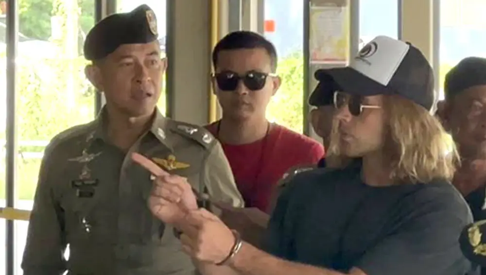 Spanish chef, a murder suspect Daniel Jeronimo Sancho Bronchalo, (R) is escorted by Thai police officers during a crime reenactment at a scene in Koh Phangan island, southern Thailand, 06 August 2023.