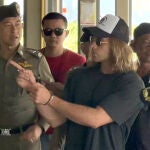 Spanish chef, a murder suspect Daniel Jeronimo Sancho Bronchalo, (R) is escorted by Thai police officers during a crime reenactment at a scene in Koh Phangan island, southern Thailand, 06 August 2023. 