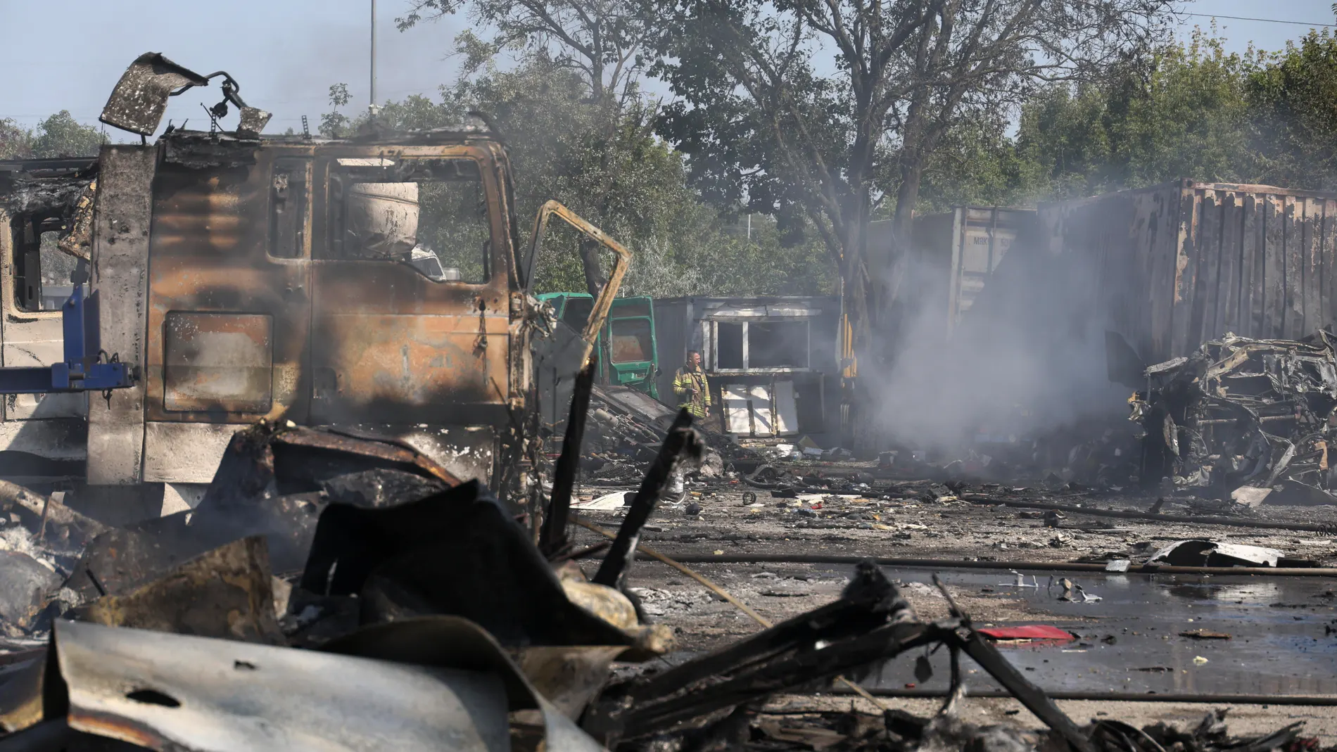 Odesa (Ukraine), 26/08/2024.- The site of rocket strikes at a motor transport depot of a private enterprise near Odesa, South Ukraine, 26 August 2024, after combined shelling around all of the territory of Ukraine. As a result of the explosions, a fire started, 15 trucks were destroyed, in particular, refrigerators with oil burned, and at least three drivers were injured. Ukrainian President Volodymyr Zelensky wrote on his Telegram channel that Ukraine experienced a heavy Russian missile and ...