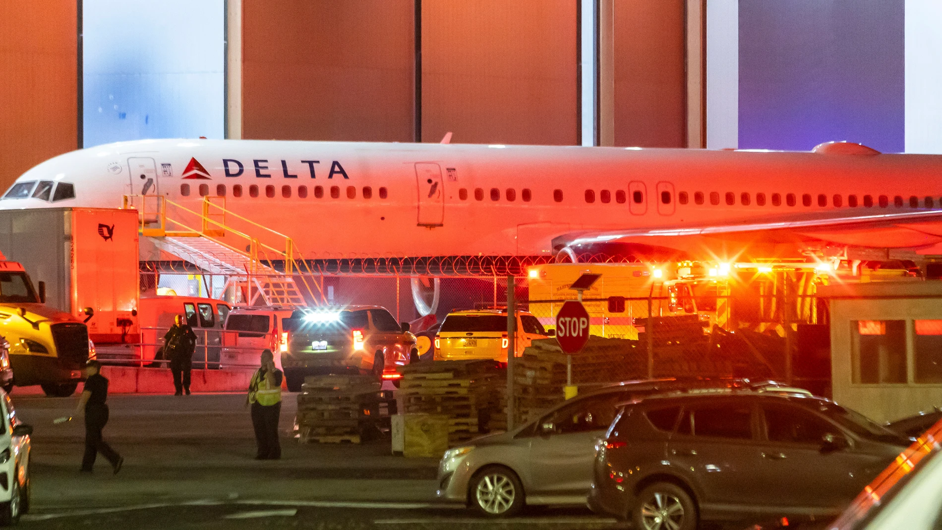 Multiple Atlanta Fire Rescue Department units and police park outside a Delta Maintenance facility near Hartsfield-Jackson International Airport early Tuesday, Aug. 27, 2024 in Atlanta. (John Spink/Atlanta Journal-Constitution via AP)