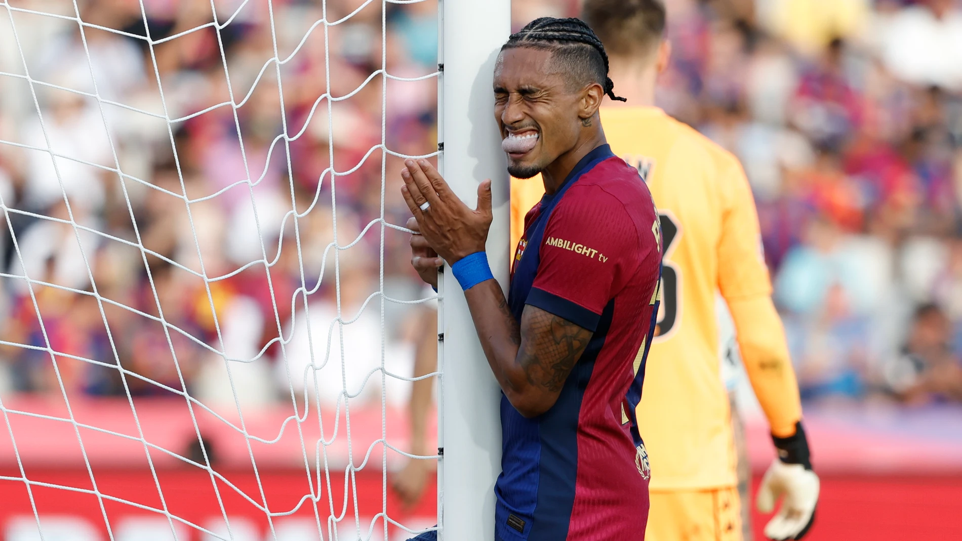 Barcelona's Raphinha gestures during the Spanish La Liga soccer match between FC Barcelona and Valladolid at the Olympic stadium in Barcelona, Spain, Saturday, Aug. 31, 2024. (AP Photo/Joan Monfort)
