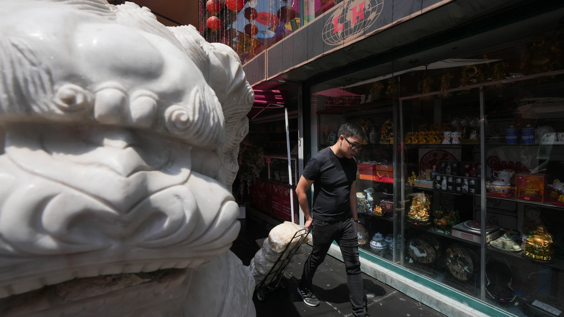 A man pulls bags of bean sprouts in Chinatown, in Mexico City's historic center, Saturday, June 8, 2024. (AP Photo/Fernando Llano)