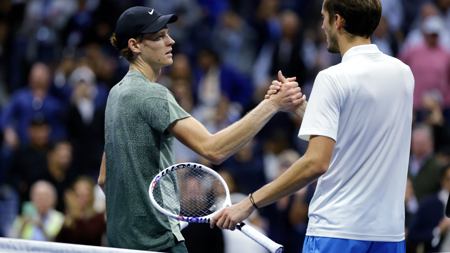 Jannik Sinner, of Italy, left, shakes hands after defeating Daniil Medvedev, of Russia, during the quarterfinals of the U.S. Open tennis championships, Wednesday, Sept. 4, 2024, in New York. (AP Photo/Adam Hunger)