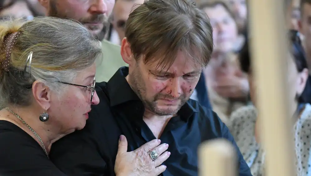 Ukraine bids farewell to mother and daughters killed in Russian strike on Lviv
