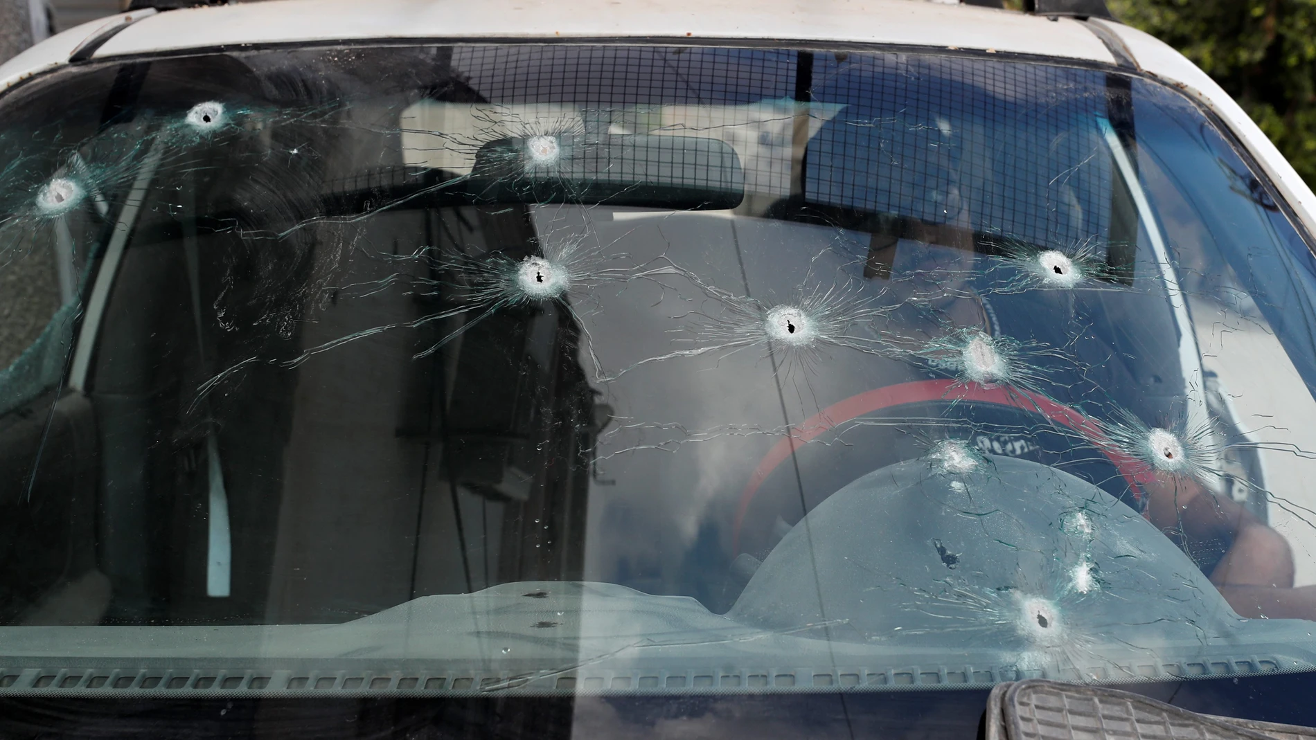 Jenin Camp (-), 06/09/2024.- A Palestinian man inspects a damaged car with bullet holes in the windshield after a nine-day Israeli military operation, in Jenin refugee camp, near the West Bank city of Jenin, 06 September 2024. At least 39 Palestinians, including eight children and two elderly people, have been killed and around 150 others injured since the start of Israeli military operations in the West Bank on 28 August 2024, according to the Palestinian Ministry of Health. The Israeli mili...