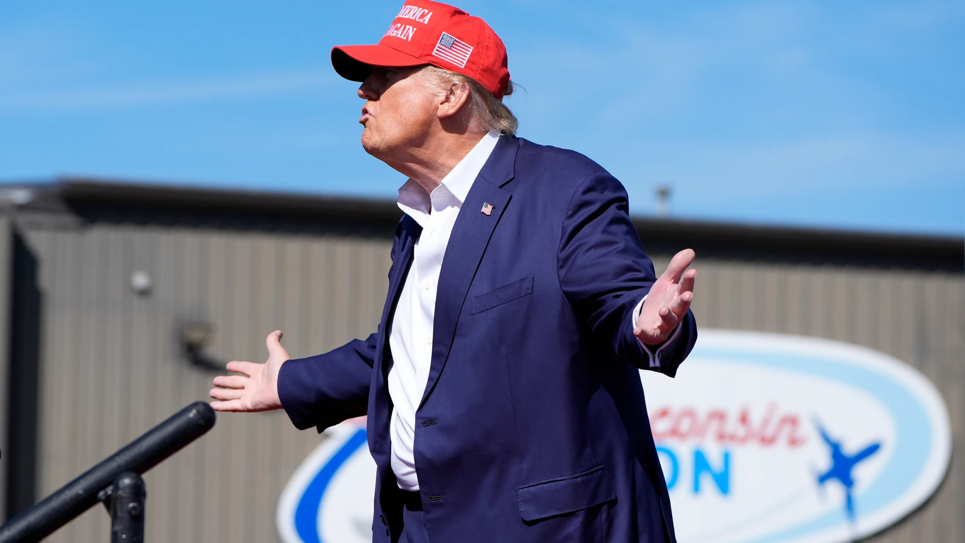Republican presidential nominee former President Donald Trump gestures as he departs a campaign event at Central Wisconsin Airport, Saturday, Sept. 7, 2024, in Mosinee, Wis. (AP Photo/Alex Brandon)