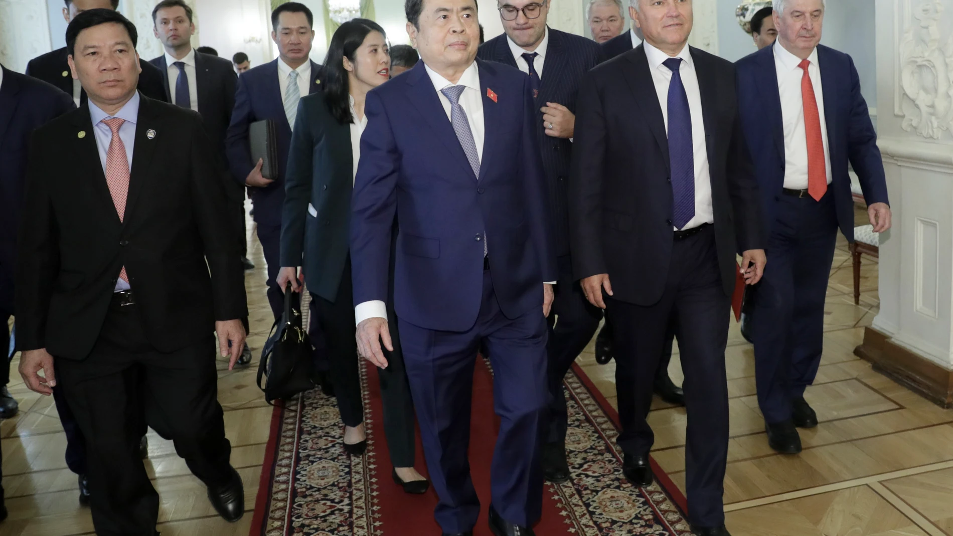 In this handout photo released by the press service of The State Duma, Lower House of the Russian Parliament Press Service, Chairman of the National Assembly of Vietnam Tran Thanh Man, center, flanked by Vyacheslav Volodin, speaker of the Lower House of Parliament, arrive for the talks in Moscow, Russia, Monday, Sept. 9, 2024. (The State Duma, Lower House of the Russian Parliament Press Service via AP)