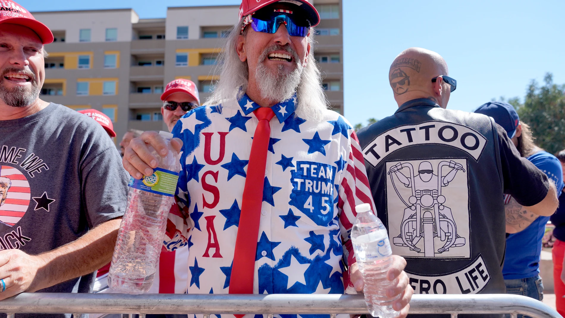 Kyle, of Mesa, Ariz., center, stands in line before a campaign event for Republican presidential nominee former President Donald Trump at the Linda Ronstadt Music Hall, Thursday, Sept.12, 2024, in Tucson, Ariz. (AP Photo/Alex Brandon)