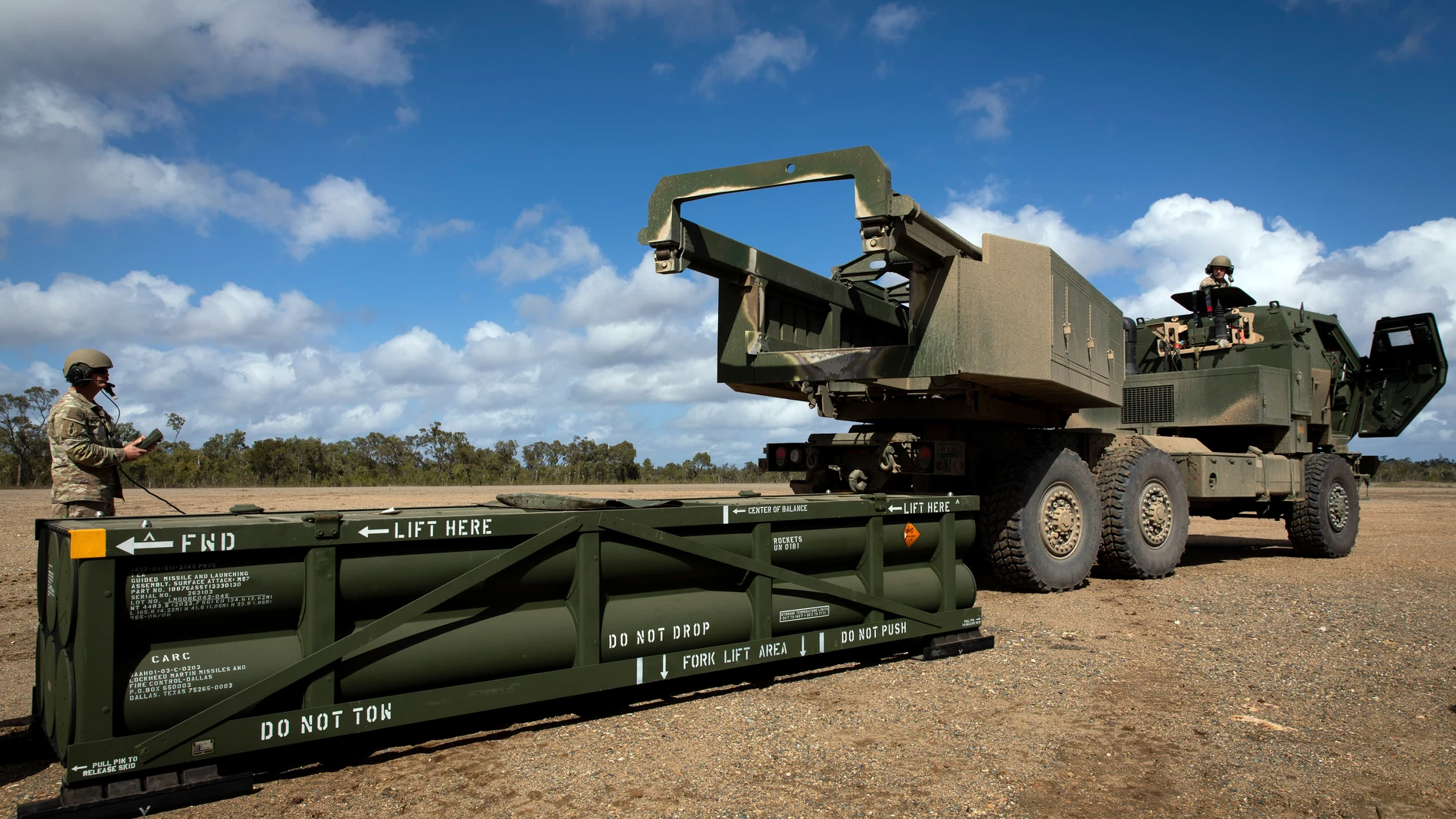 FILE - In this image provided by the U.S. Army, U.S. Army Sgt. Ian Ketterling, gunner for Alpha Battery, 1st Battalion, 3rd Field Artillery Regiment, 17th Field Artillery Brigade, prepares the crane for loading the Army Tactical Missile System (ATACMS) on to the High Mobility Artillery Rocket System (HIMARS) in Queensland, Australia, on July 26, 2023. (Sgt. 1st Class Andrew Dickson/U.S. Army via AP)