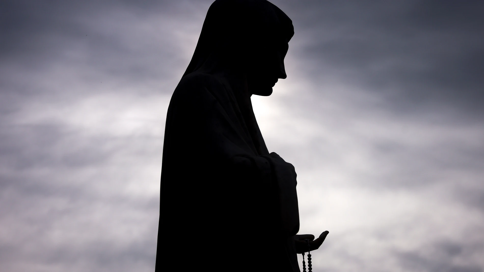 A statue of the Virgin Mary is silhouetted against the sun on the Hill of appearance where it is believed that Virgin Mary showed herself and conveyed messages of peace to six children in Medjugorje, Bosnia, Thursday, Sept. 19, 2024. (AP Photo/Armin Durgut)